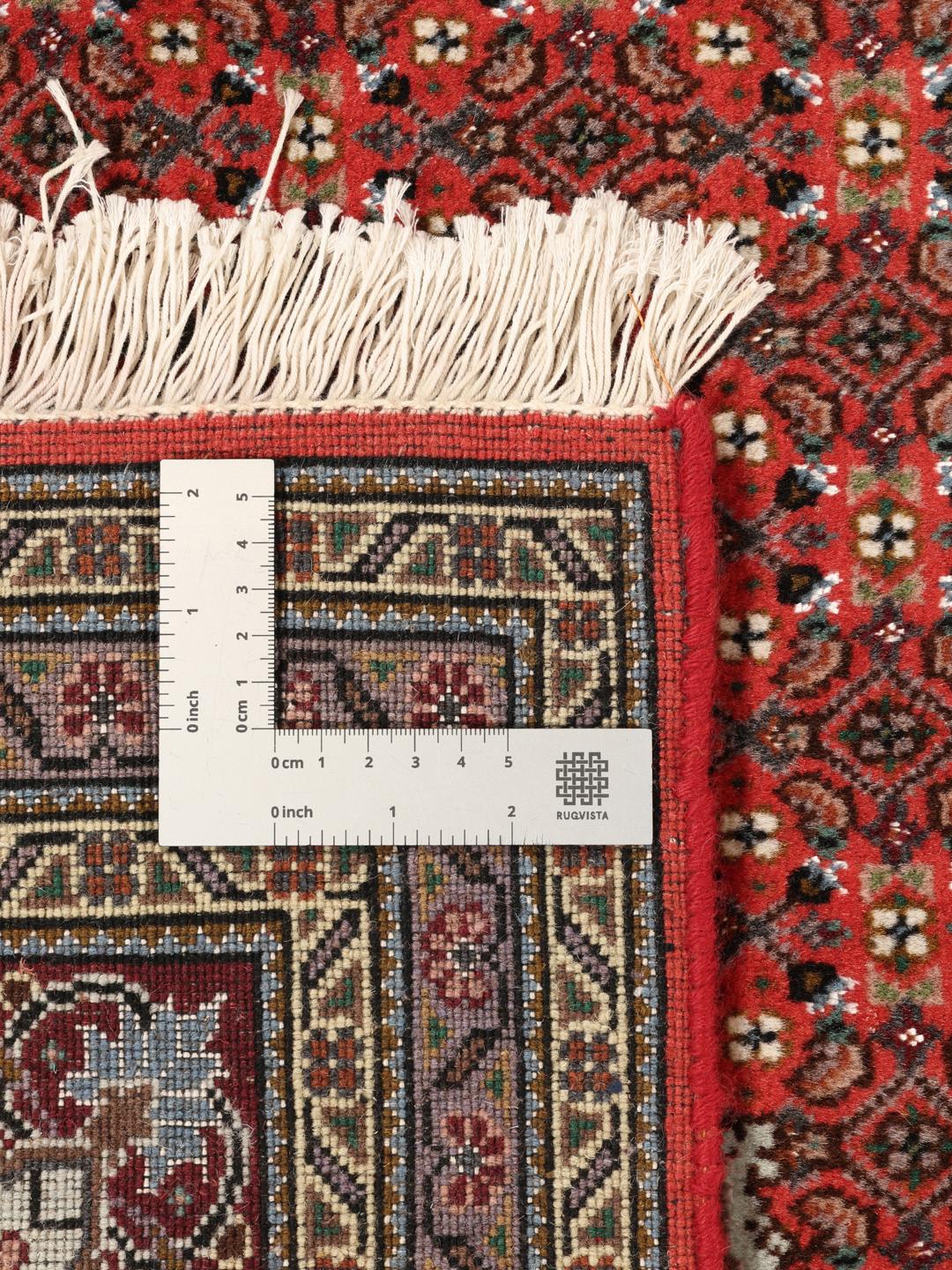 Handgeknoopt Tabriz tapijt uit het Midden-Oosten in levendige rode tinten