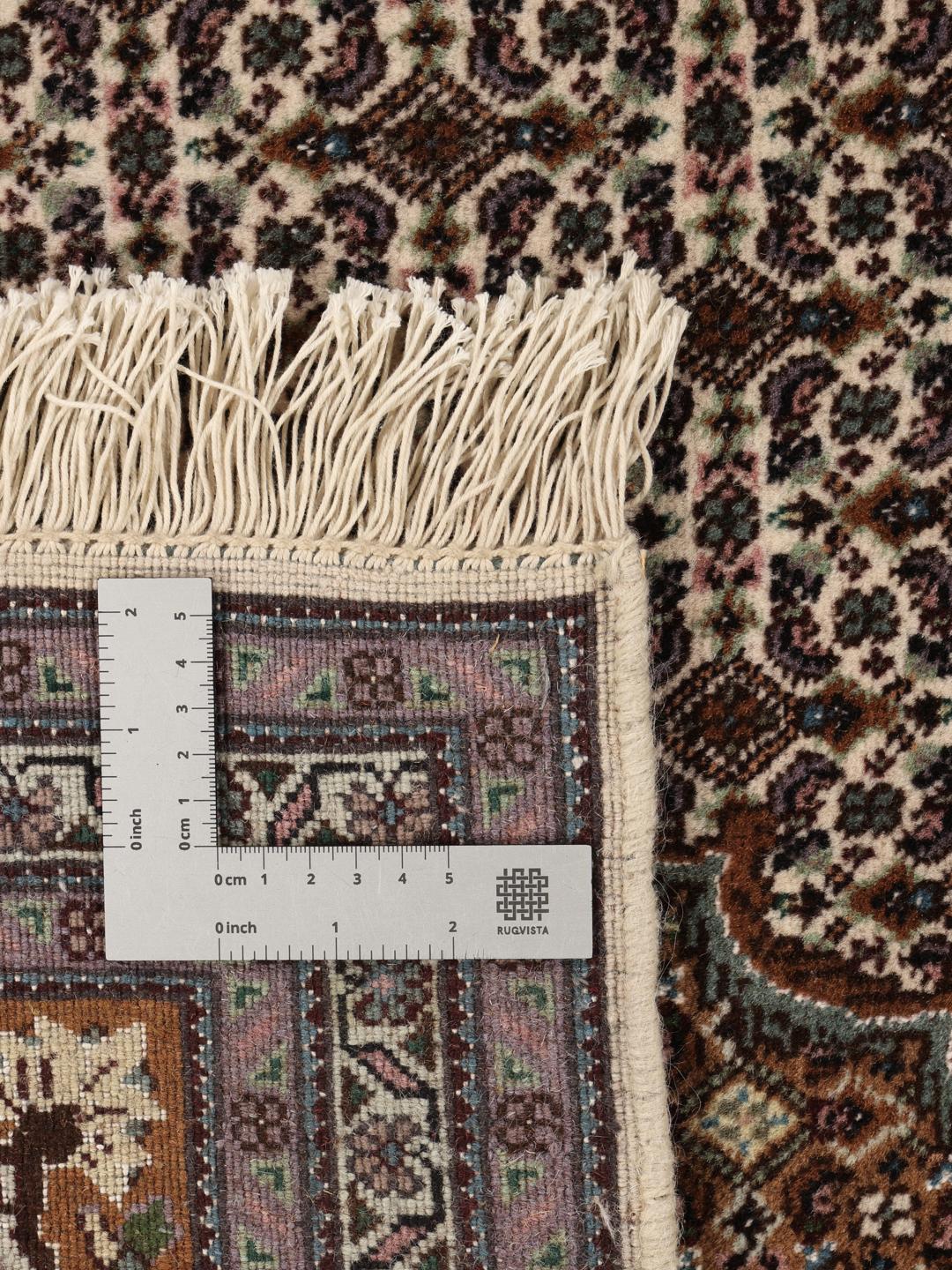 Et unikt håndknyttet Tabriz tæppe fra Mellemøsten i brune toner