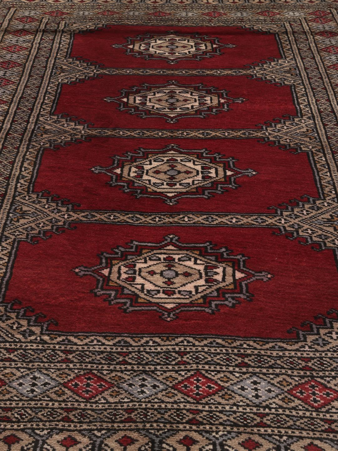 Hand-knotted red Pakistan Bokhara 2ply wool rug with medallion motifs
