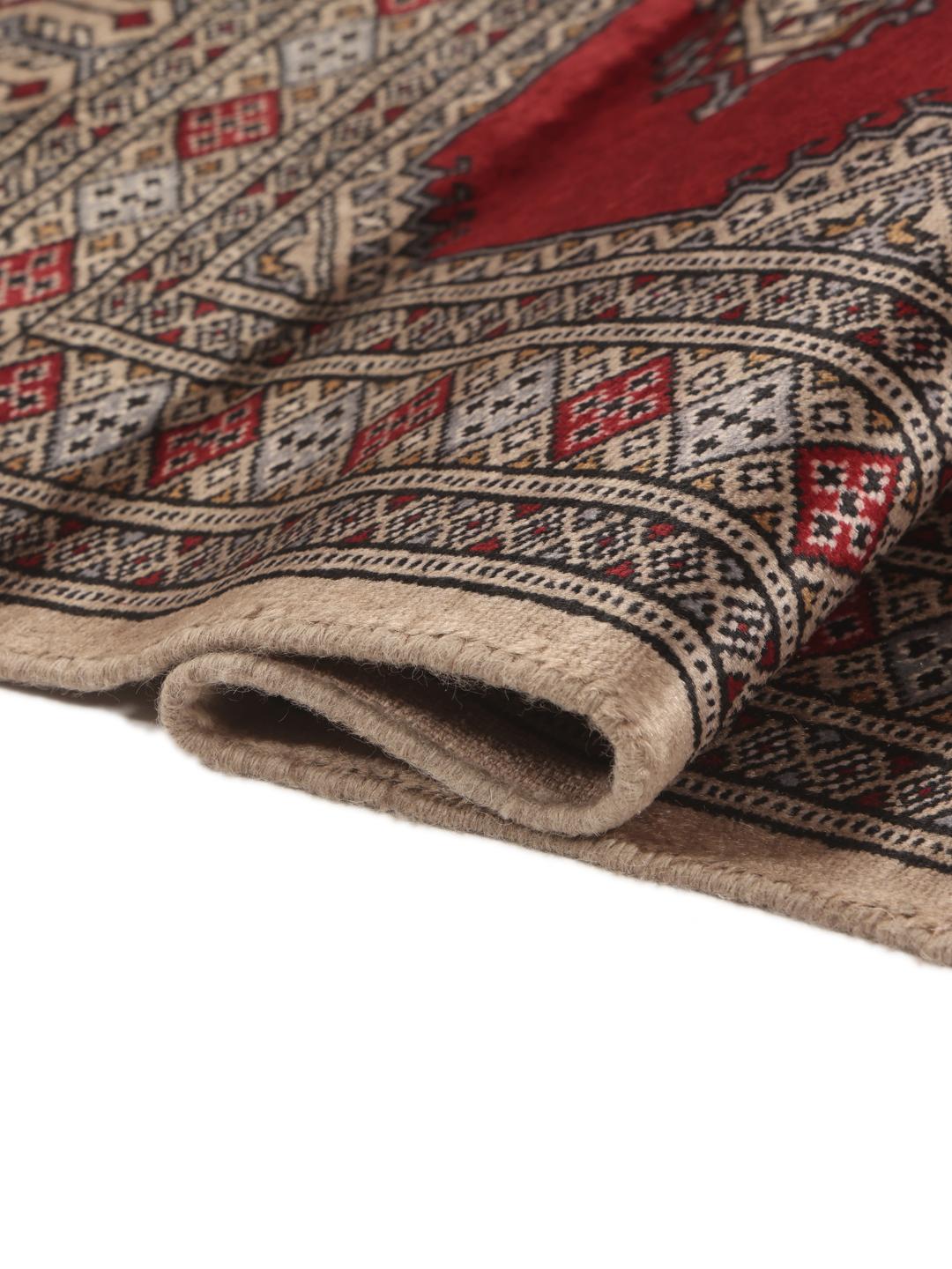 Hand-knotted red Pakistan Bokhara 2ply wool rug with medallion motifs