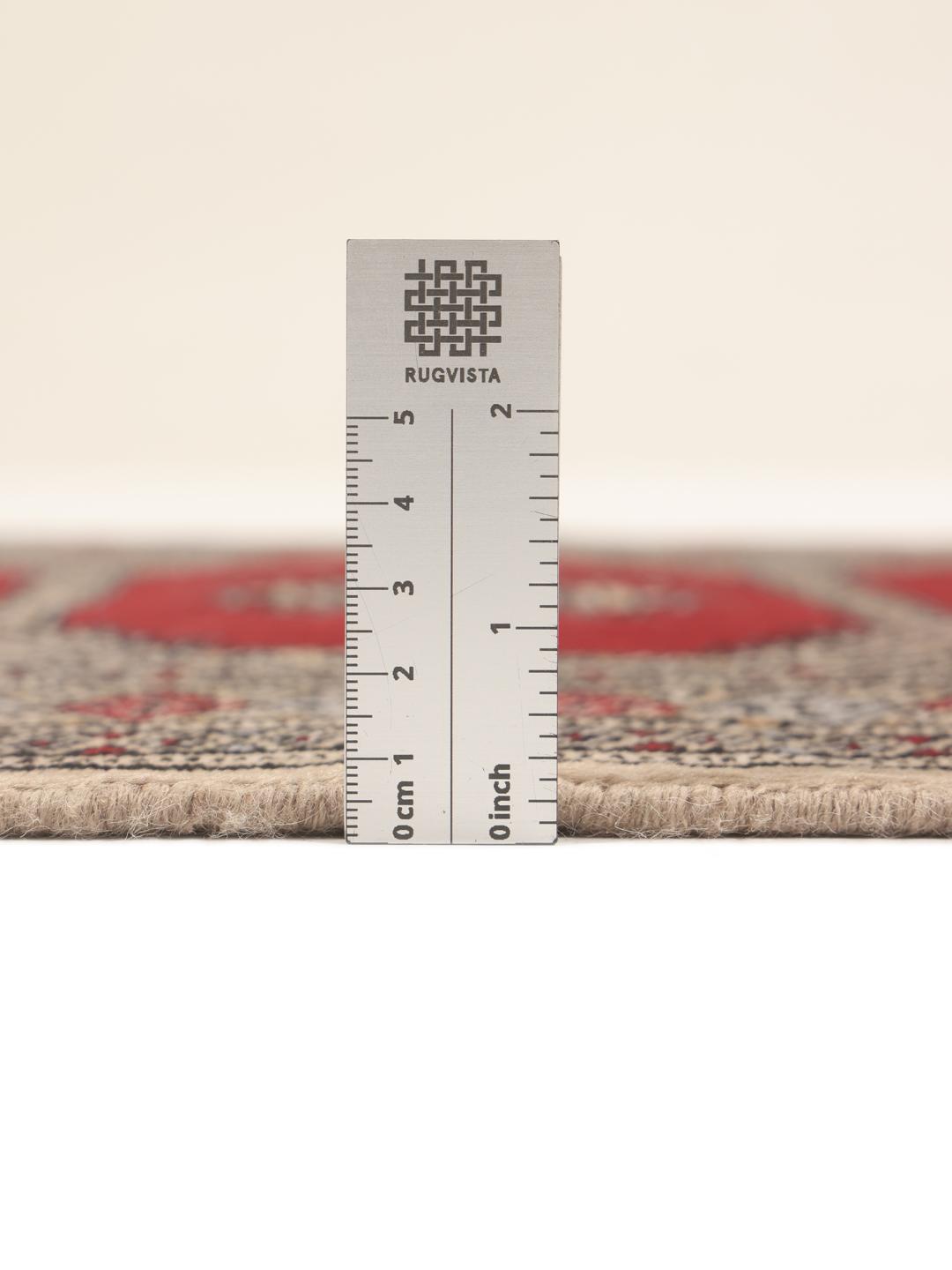 Hand-knotted red Pakistan Bokhara 2ply wool rug with medallion motifs