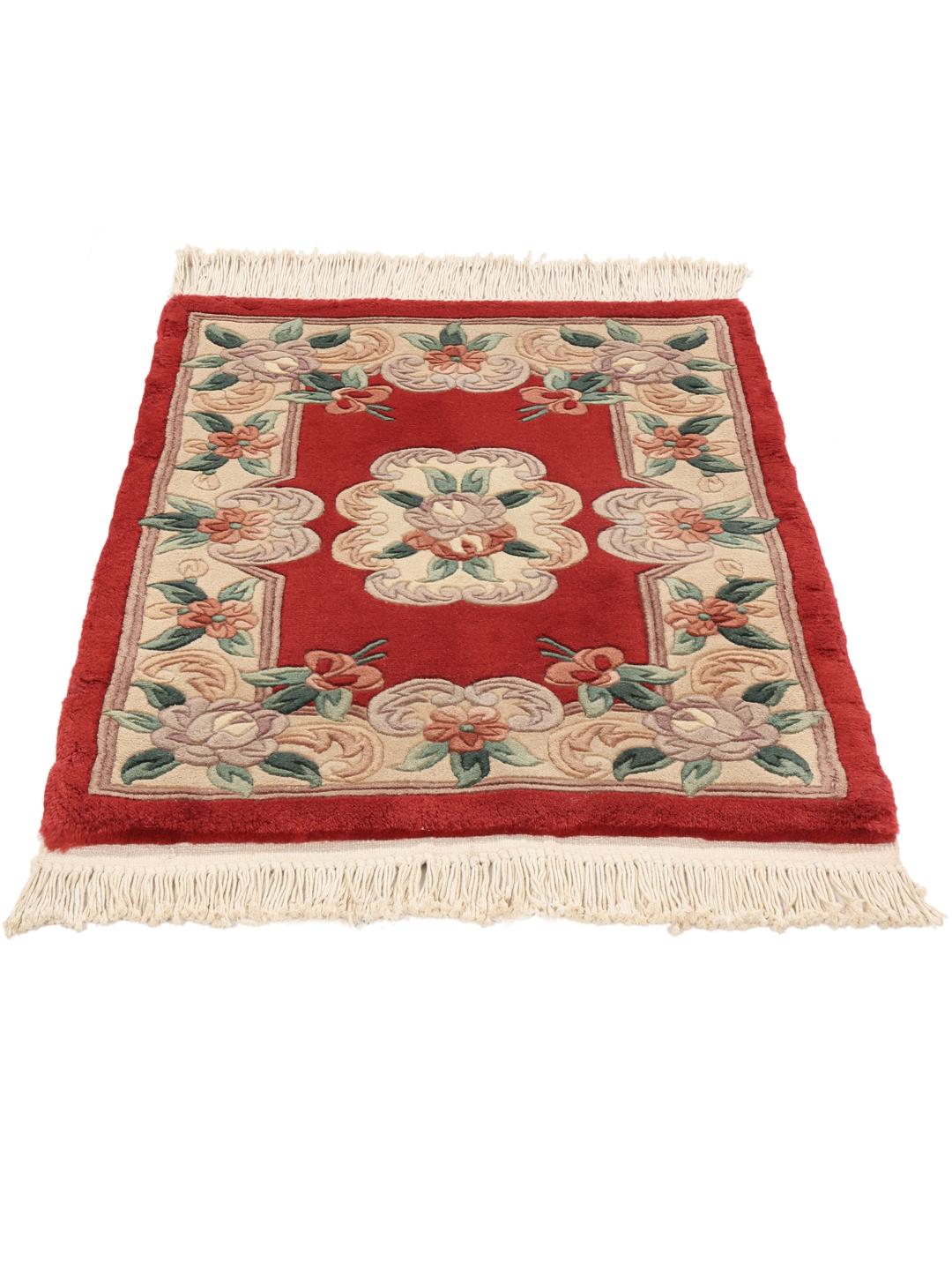 Hand-knotted Chinese rug with a red floral pattern