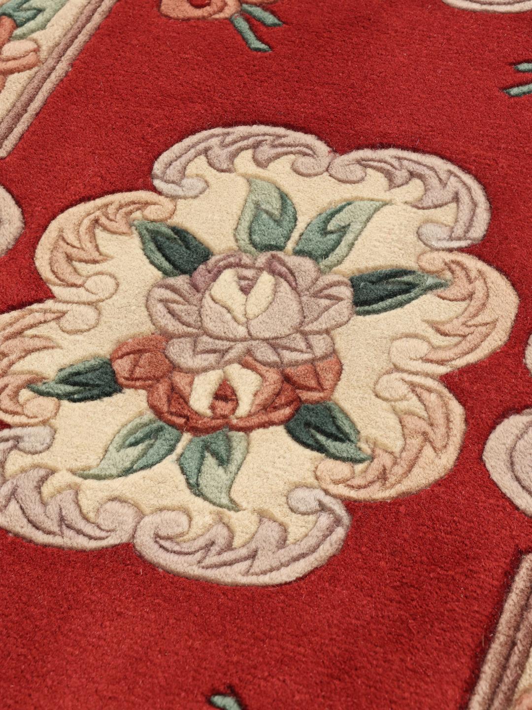 Hand-knotted Chinese rug with a red floral pattern