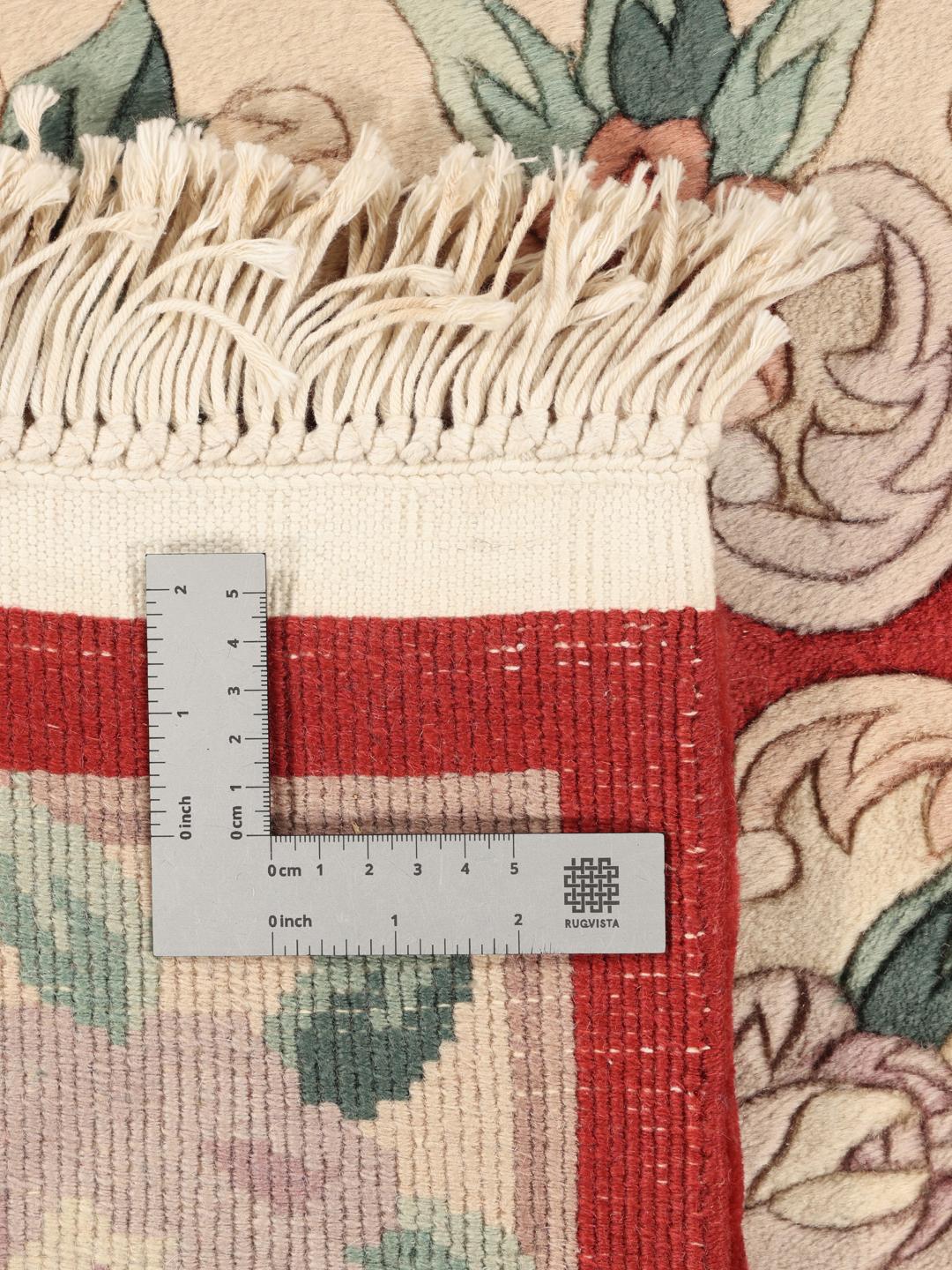 Hand-knotted Chinese rug with a red floral pattern