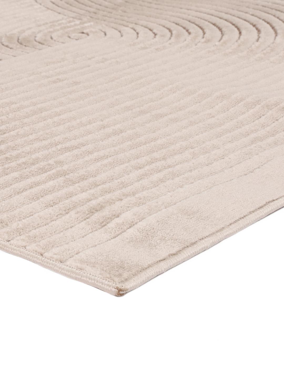 Beige tæppe med strukturerede linjer