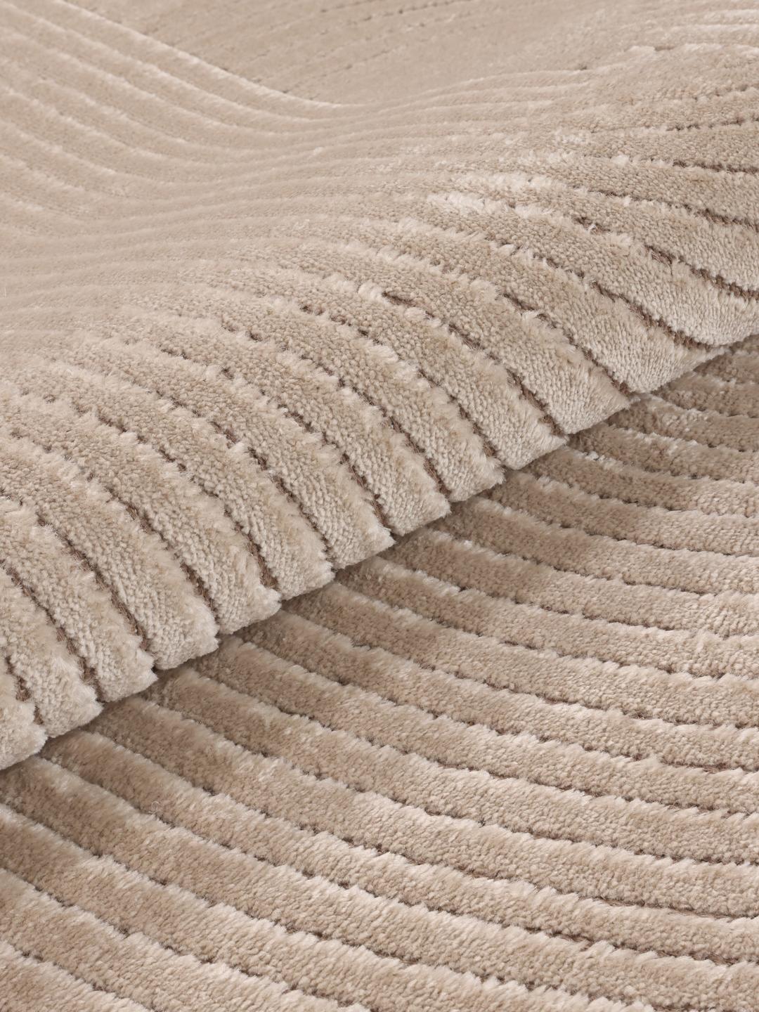 Beige tapijt met gestructureerde lijnen