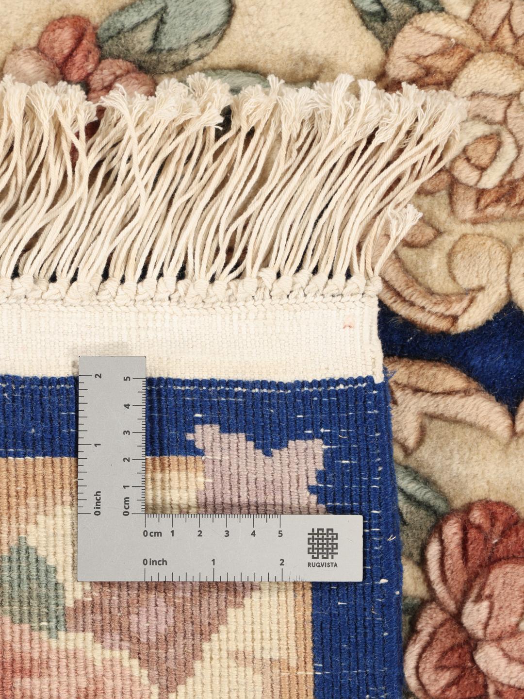 Hand-knotted Chinese rug with floral motifs in blue and cream