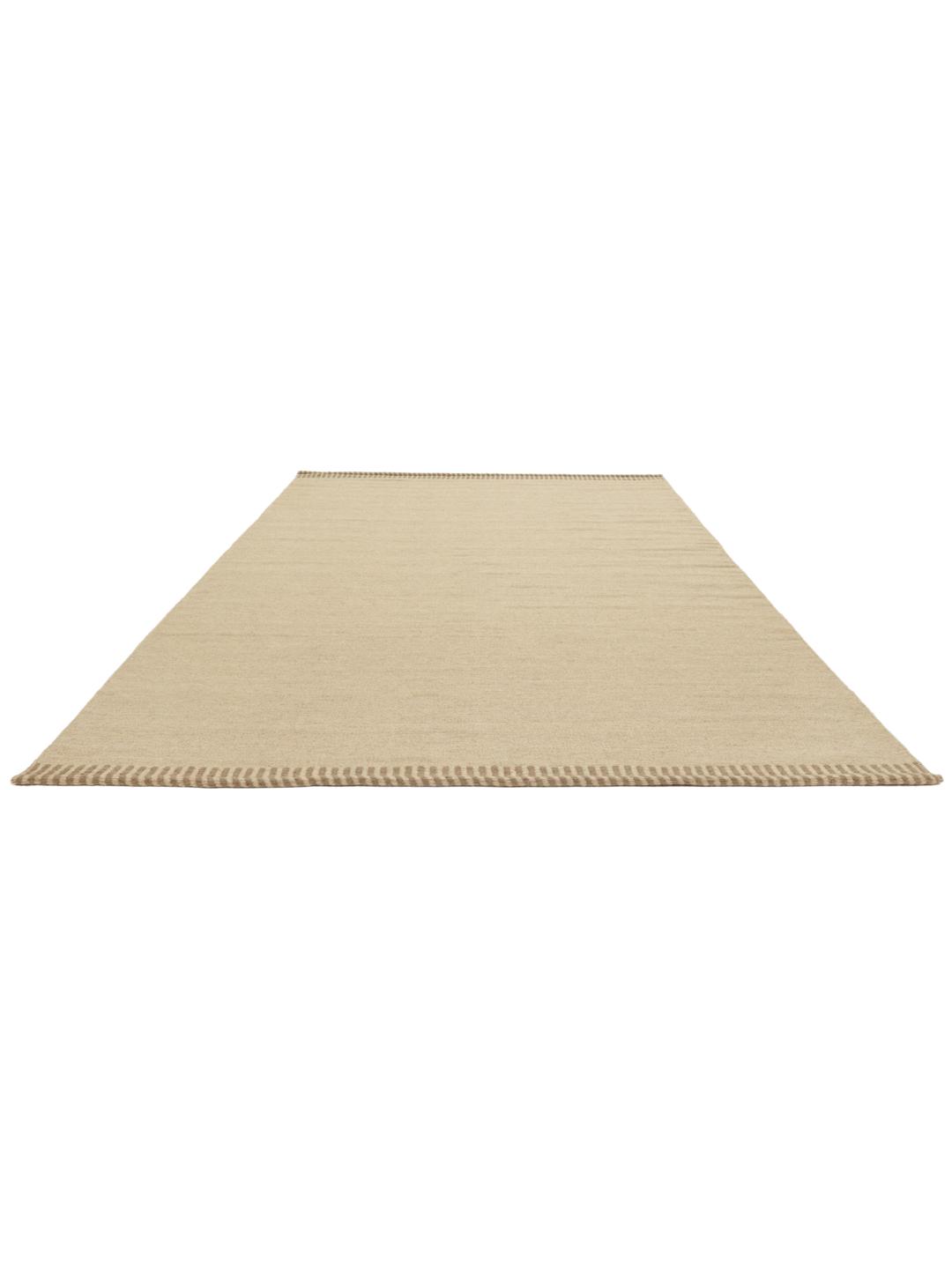 Beige tapijt met eenvoudige geweven textuur