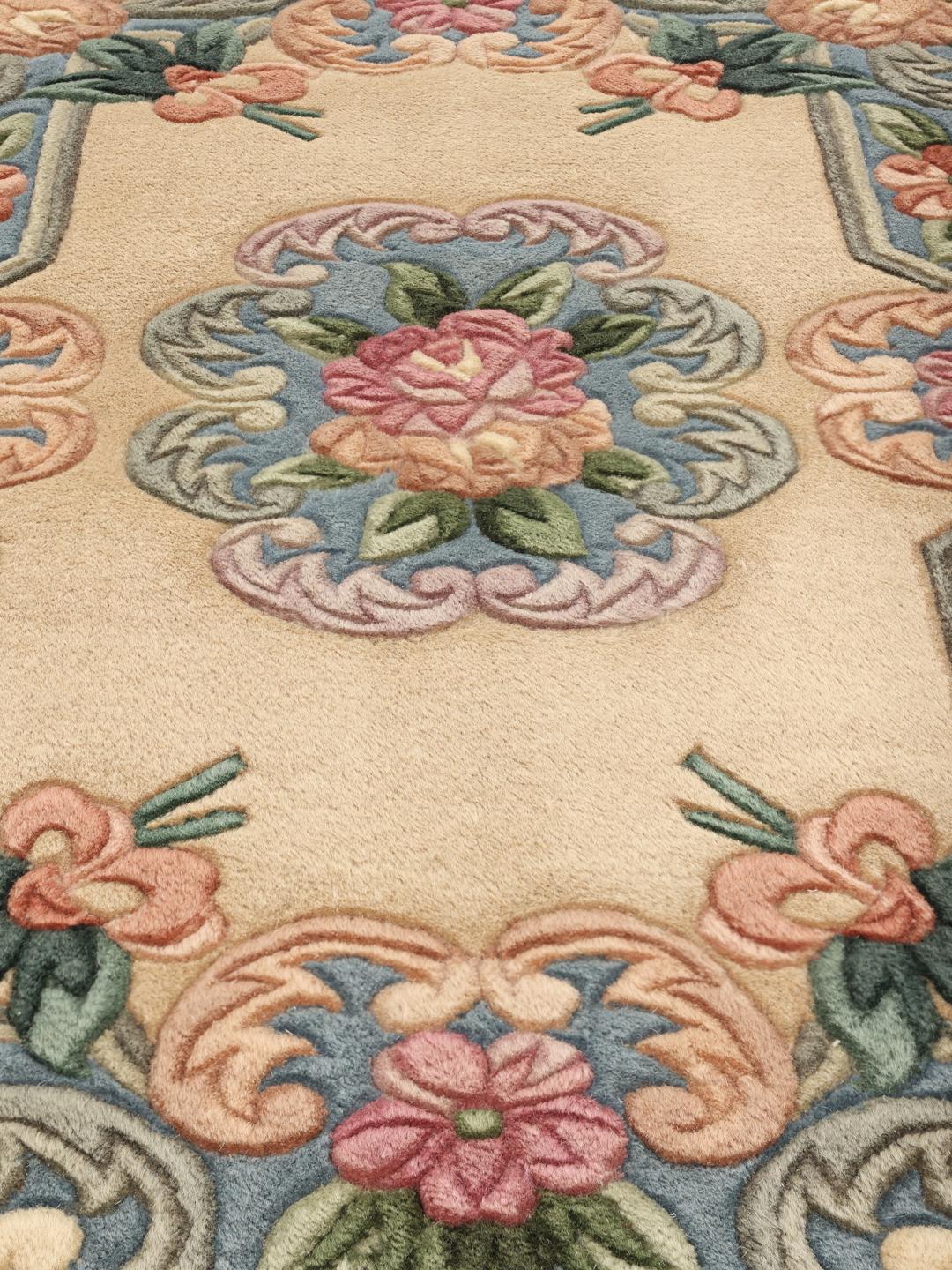 Hand-knotted floral rug from China in beige and soft blue tones