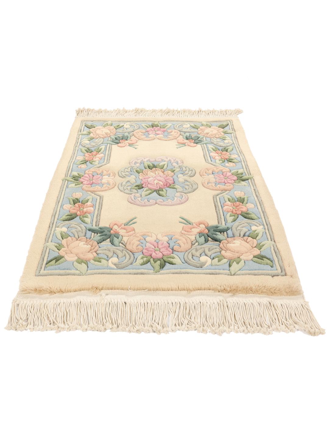 Hand-knotted floral rug from China in beige and soft blue tones