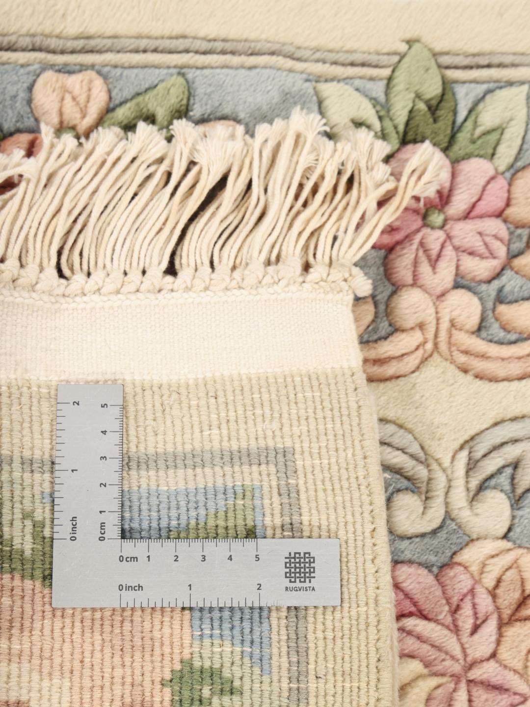 Håndknyttet kinesisk tæppe med blomstermønster i beige og blå