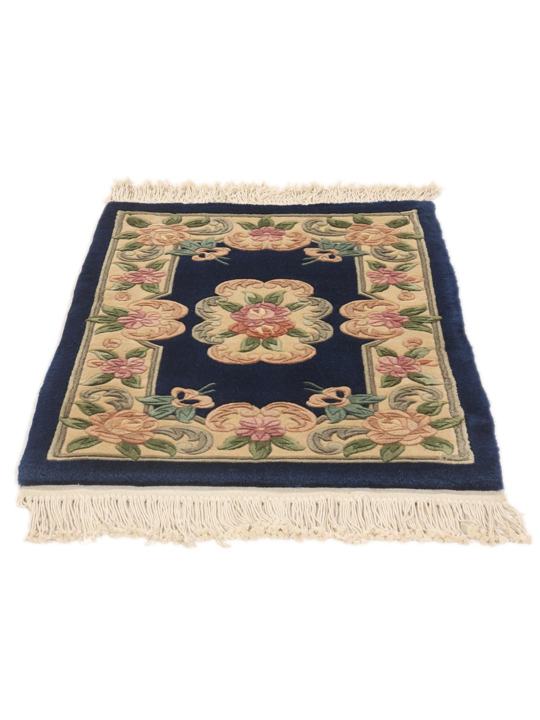 Hand-knotted Chinese rug featuring a floral pattern on a deep blue background