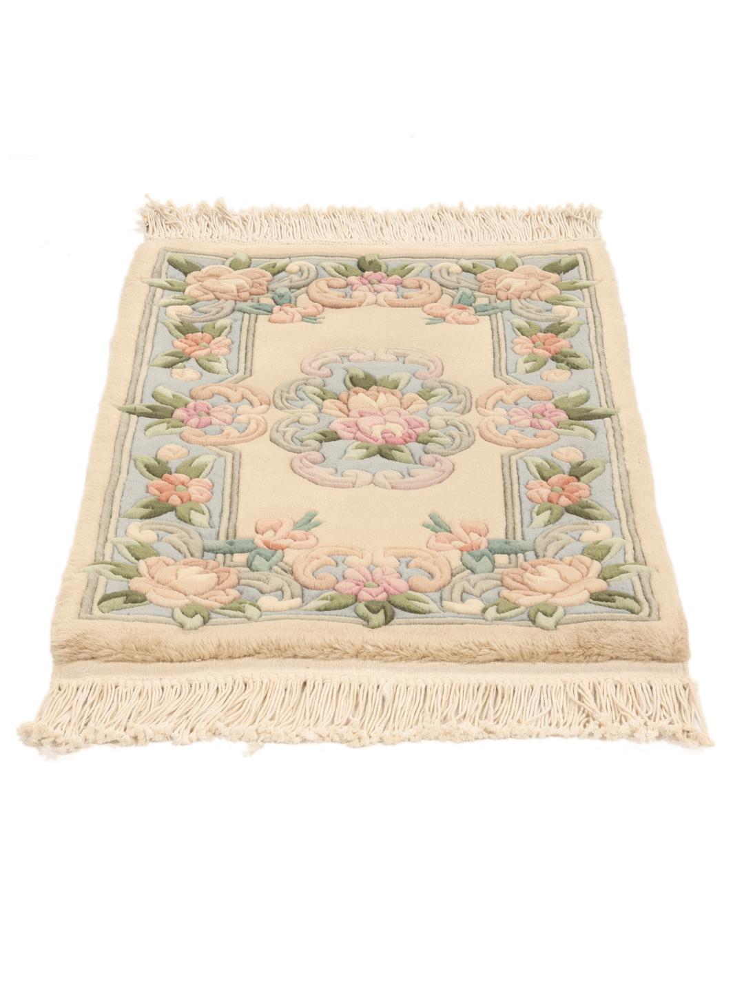 Hand-knotted floral rug from China with a beige and blue colour palette