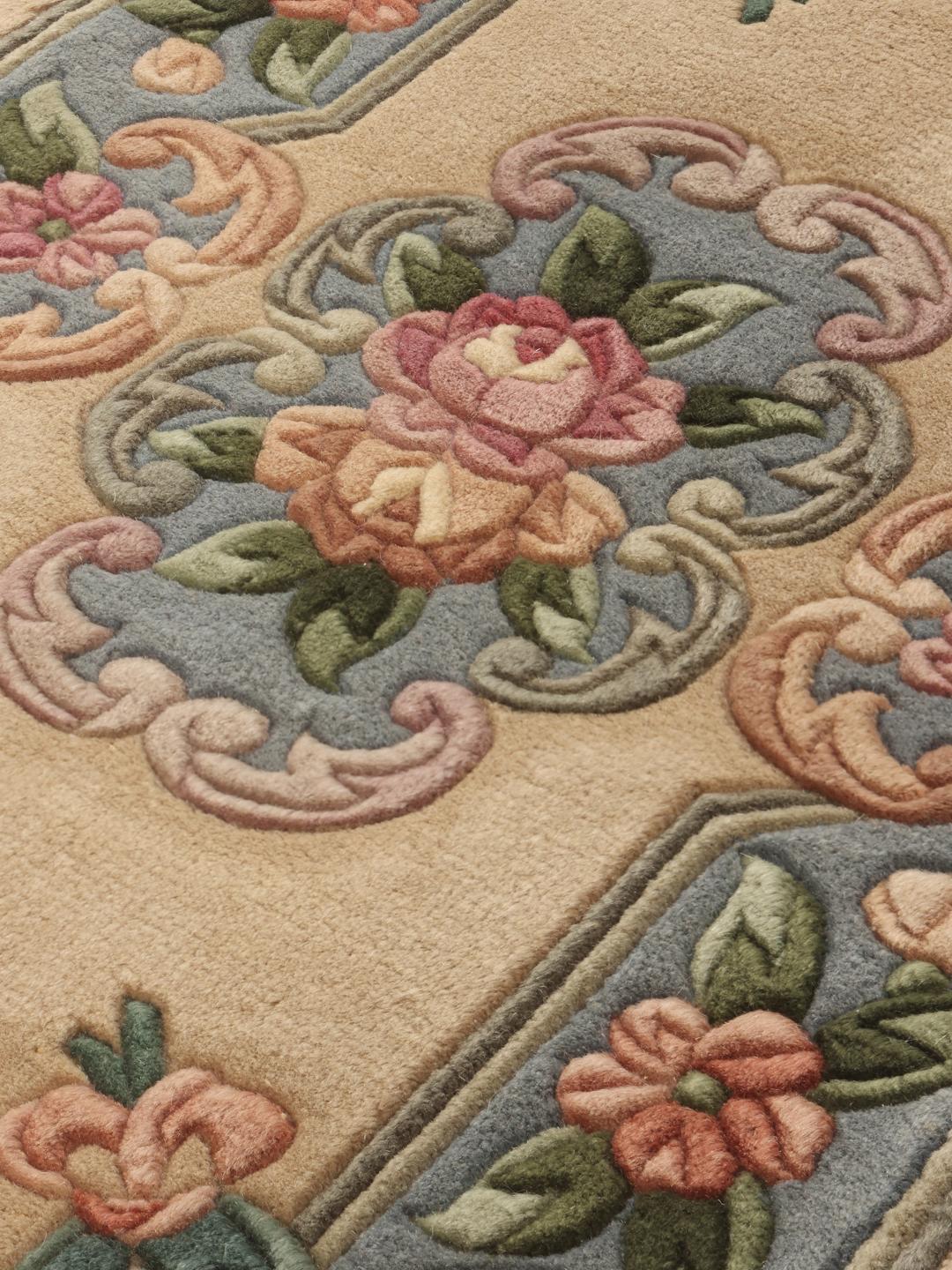 Hand-knotted floral rug from China with a beige and blue colour palette