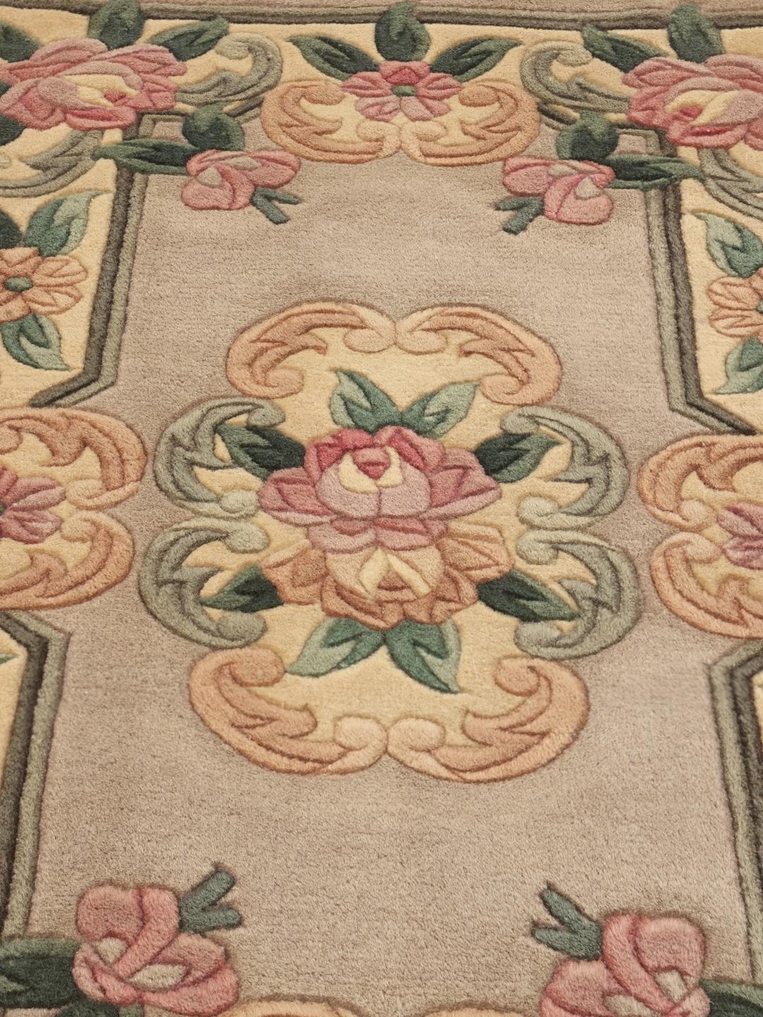 Hand-knotted Chinese rug with floral motifs in beige, pink, and green