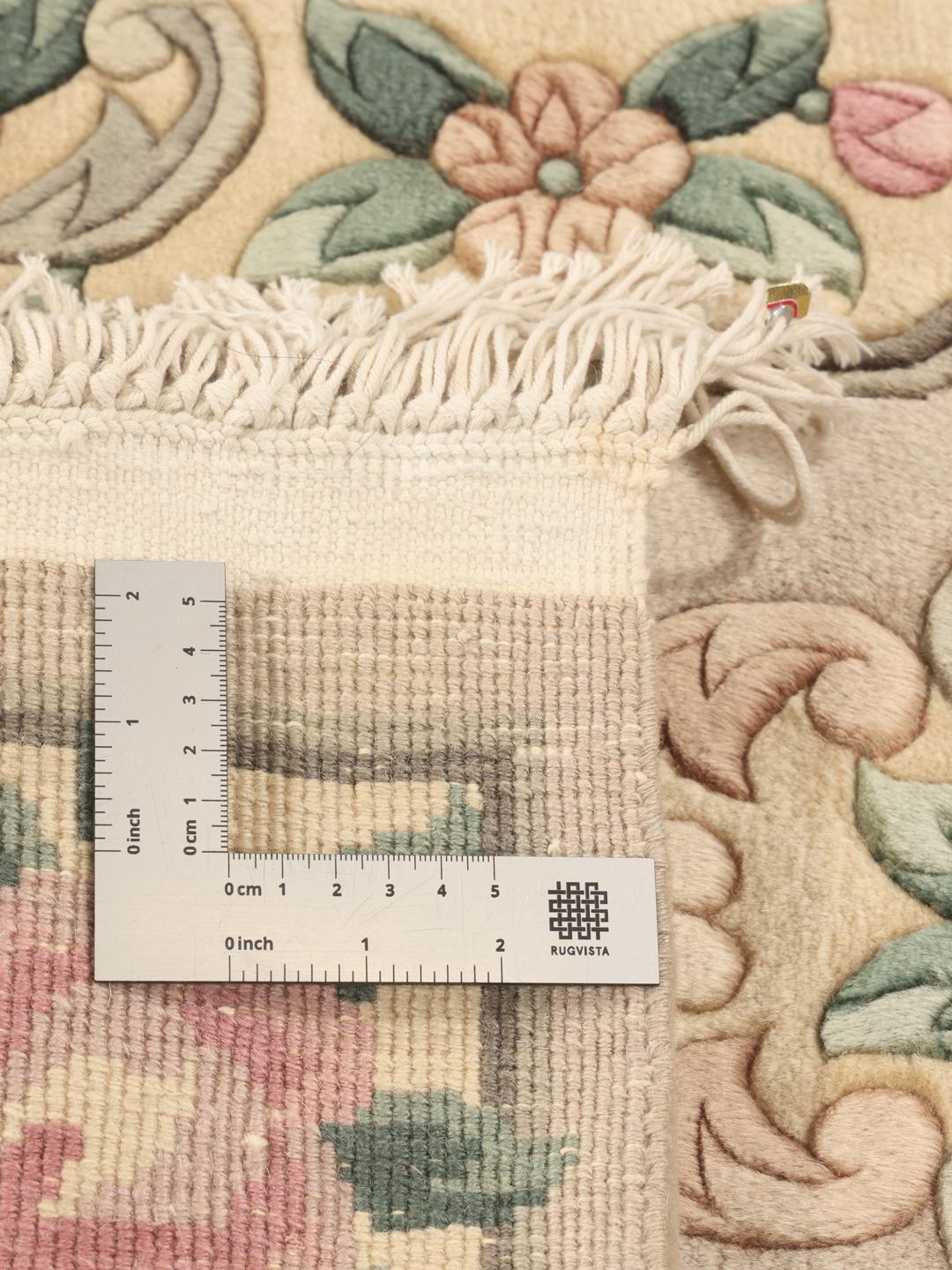 Hand-knotted Chinese rug with floral motifs in beige, pink, and green