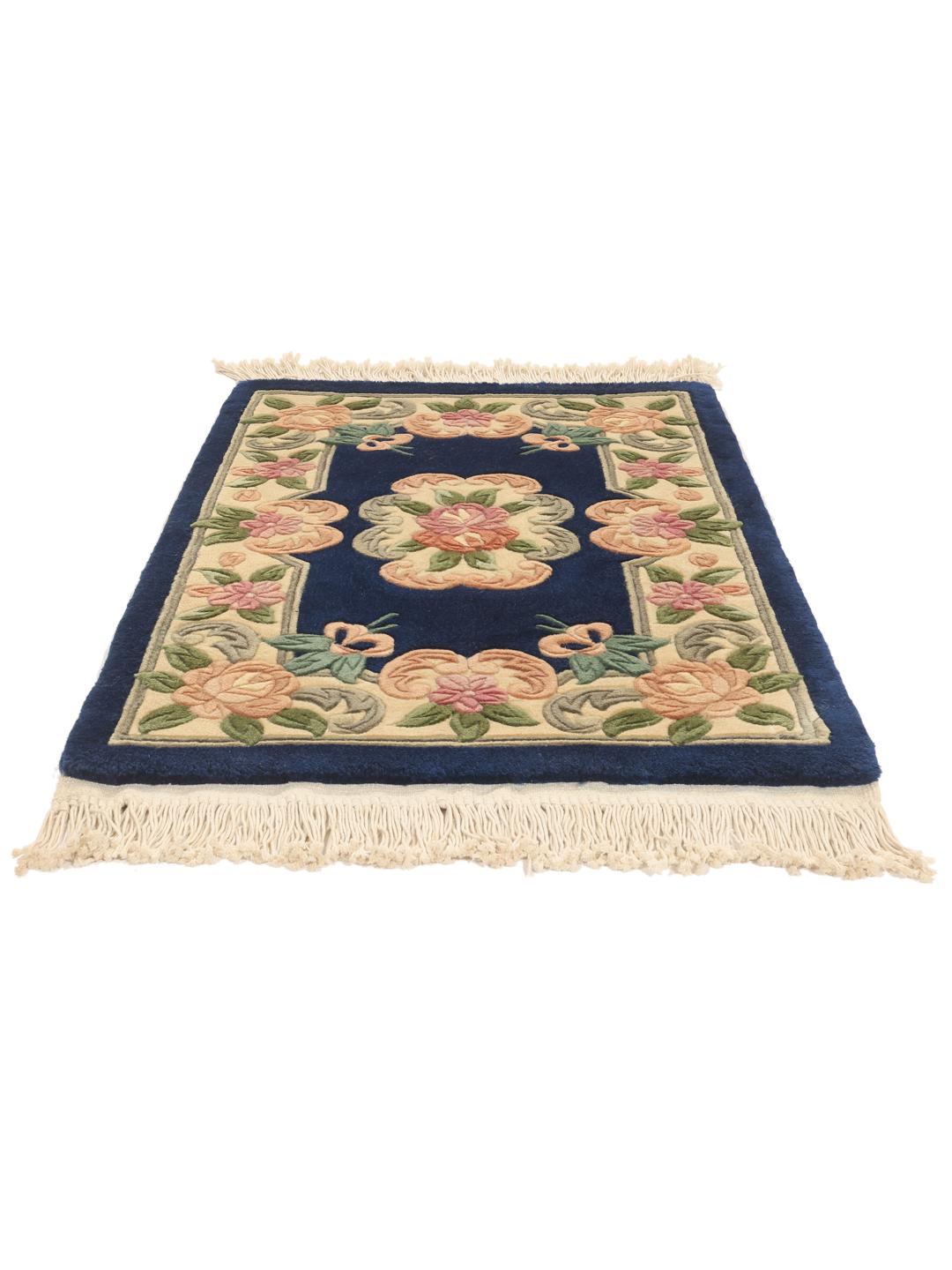 Hand-knotted Chinese rug with floral motifs in blue and soft pastel tones.