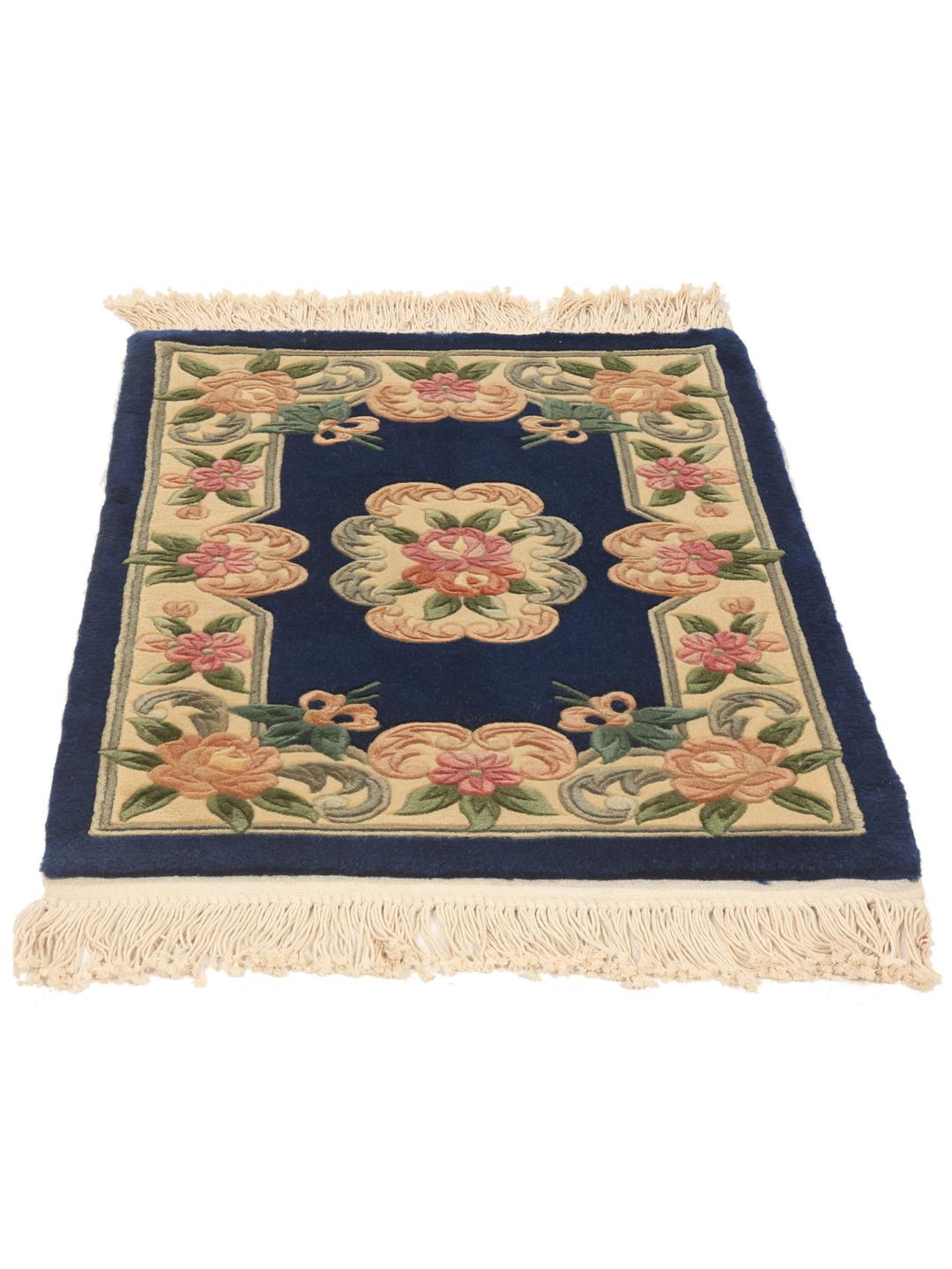 Hand-knotted Chinese rug with floral motifs on a blue background