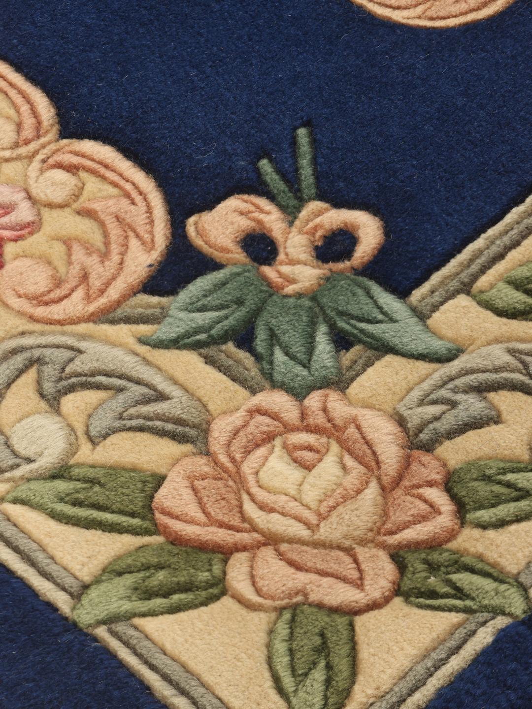 Hand-knotted Chinese rug with floral motifs on a blue background