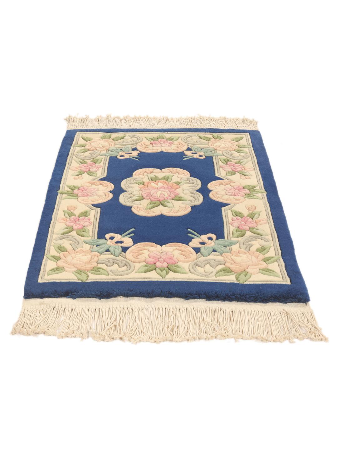 Hand-knotted Chinese rug with floral motifs on a deep blue background