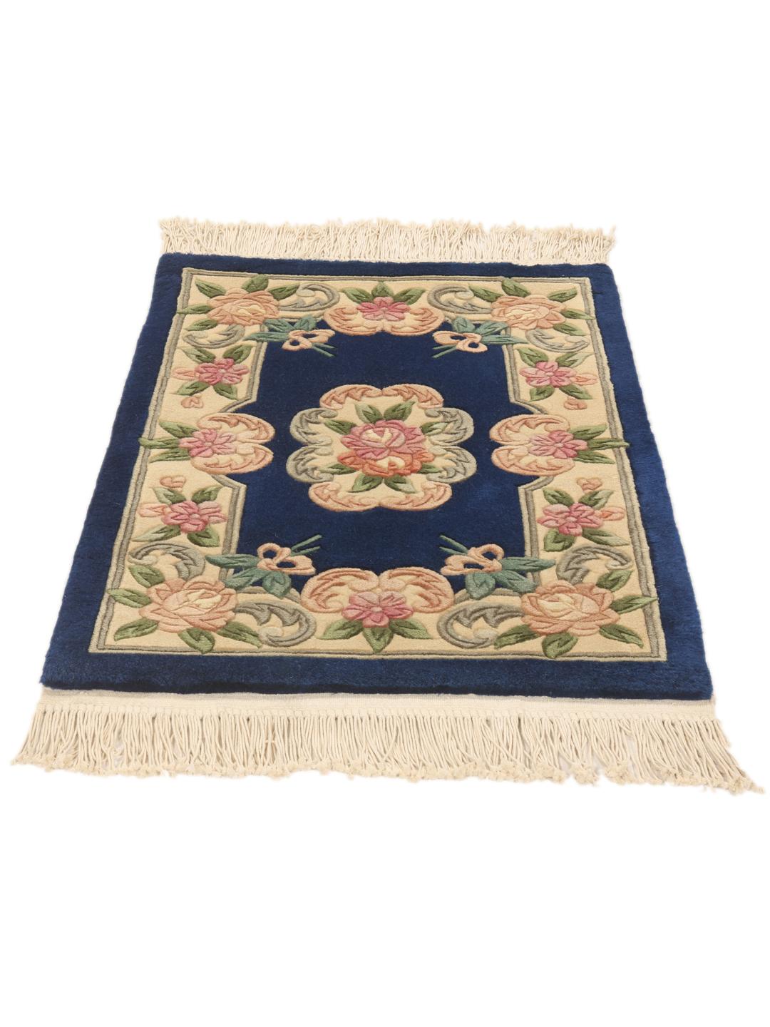 Hand-knotted Chinese rug with floral motifs on a deep blue background