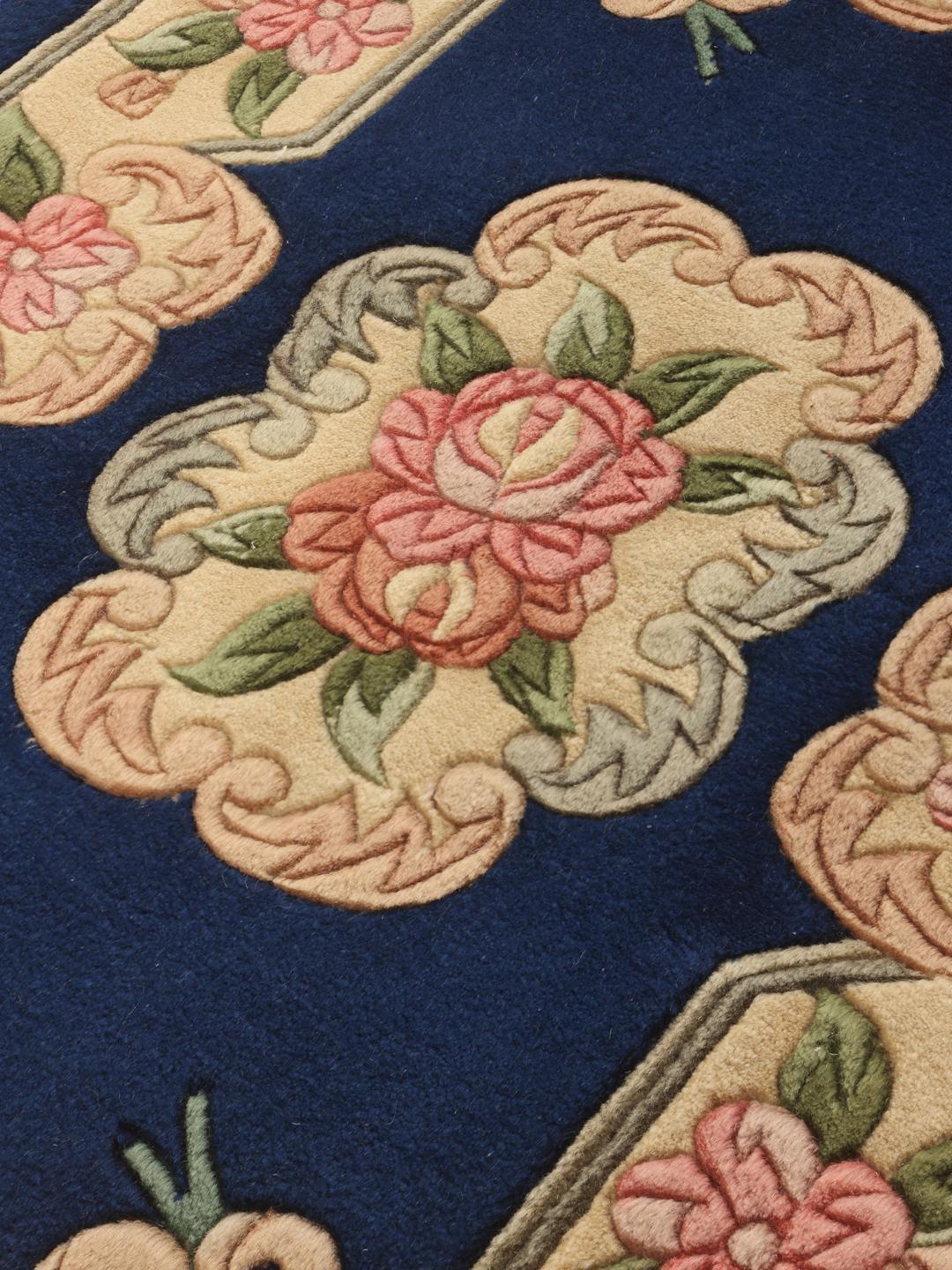 Hand-knotted Chinese rug with floral motifs on a blue and cream background