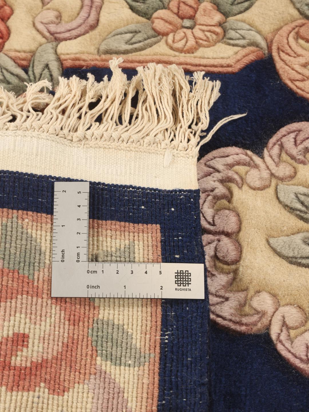 Hand-knotted Chinese rug with floral motifs on a blue and cream background