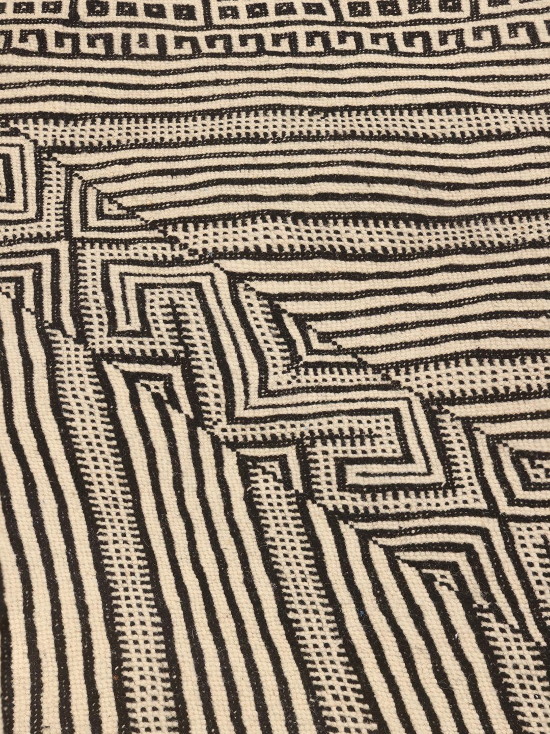 Hand-woven Moroccan High Atlas Kelim rug with a geometric diamond pattern in beige and black