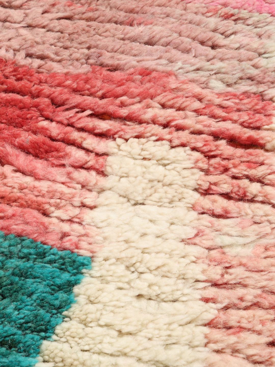 A vibrant, abstract, hand-knotted Berber Beni Ourain rug from Morocco in multicolor.