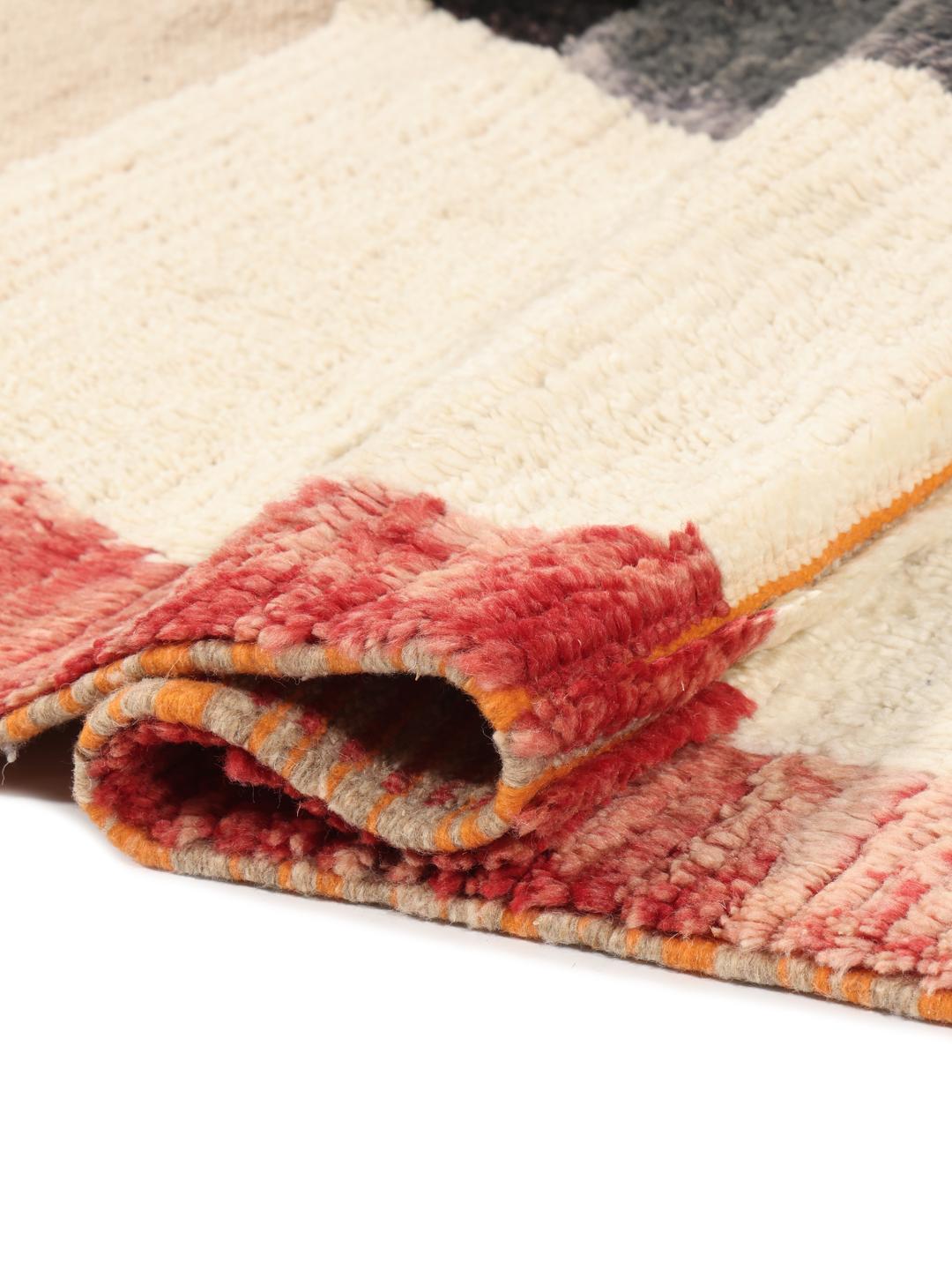 A vibrant, abstract, hand-knotted Berber Beni Ourain rug from Morocco in multicolor.