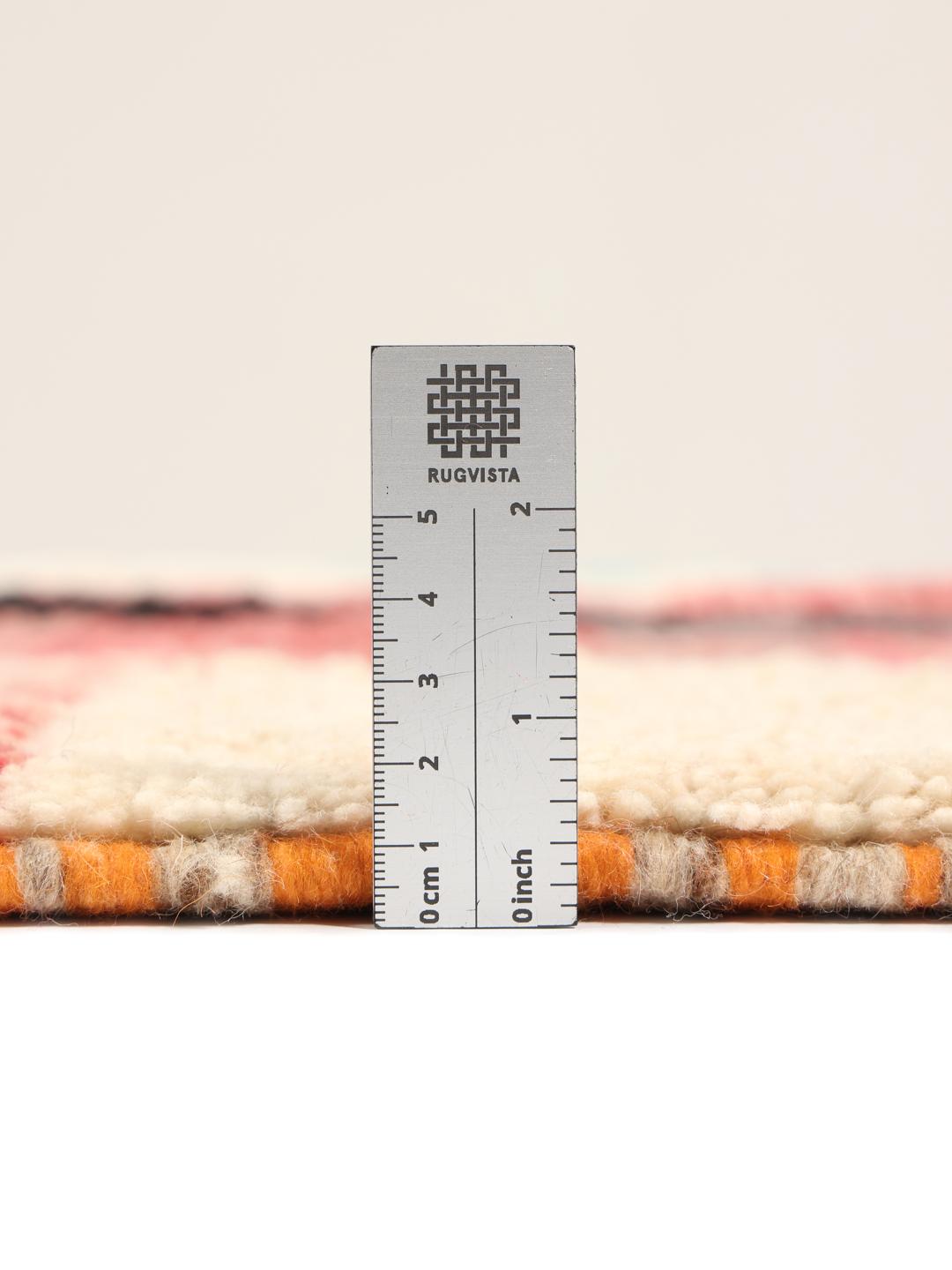 A vibrant, abstract, hand-knotted Berber Beni Ourain rug from Morocco in multicolor.