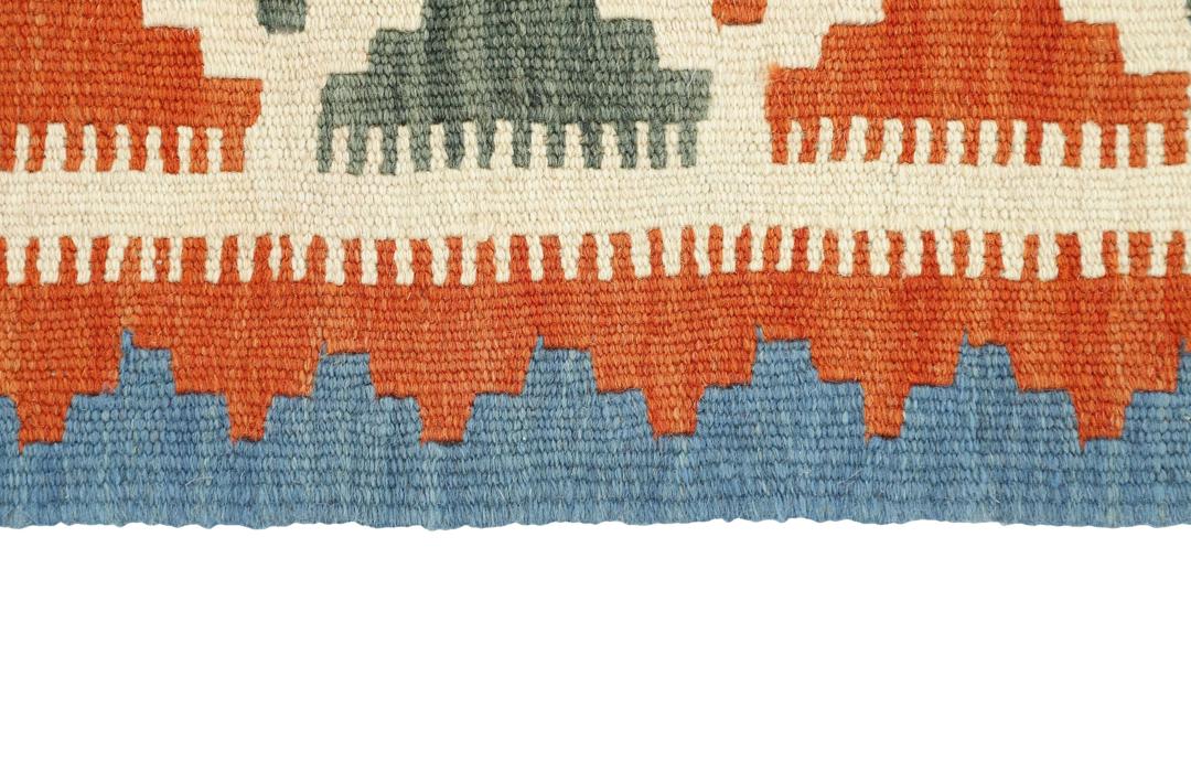 Hand woven Kilim rug from the Middle East in multicolor geometric patterns.