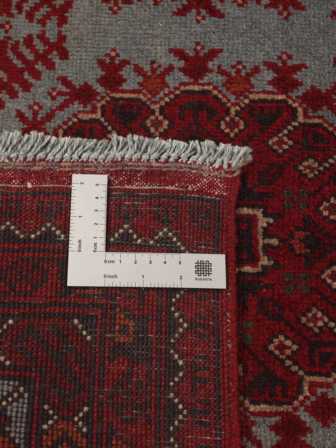 Hand-knotted Afghan Khal Mohammadi rug in deep red