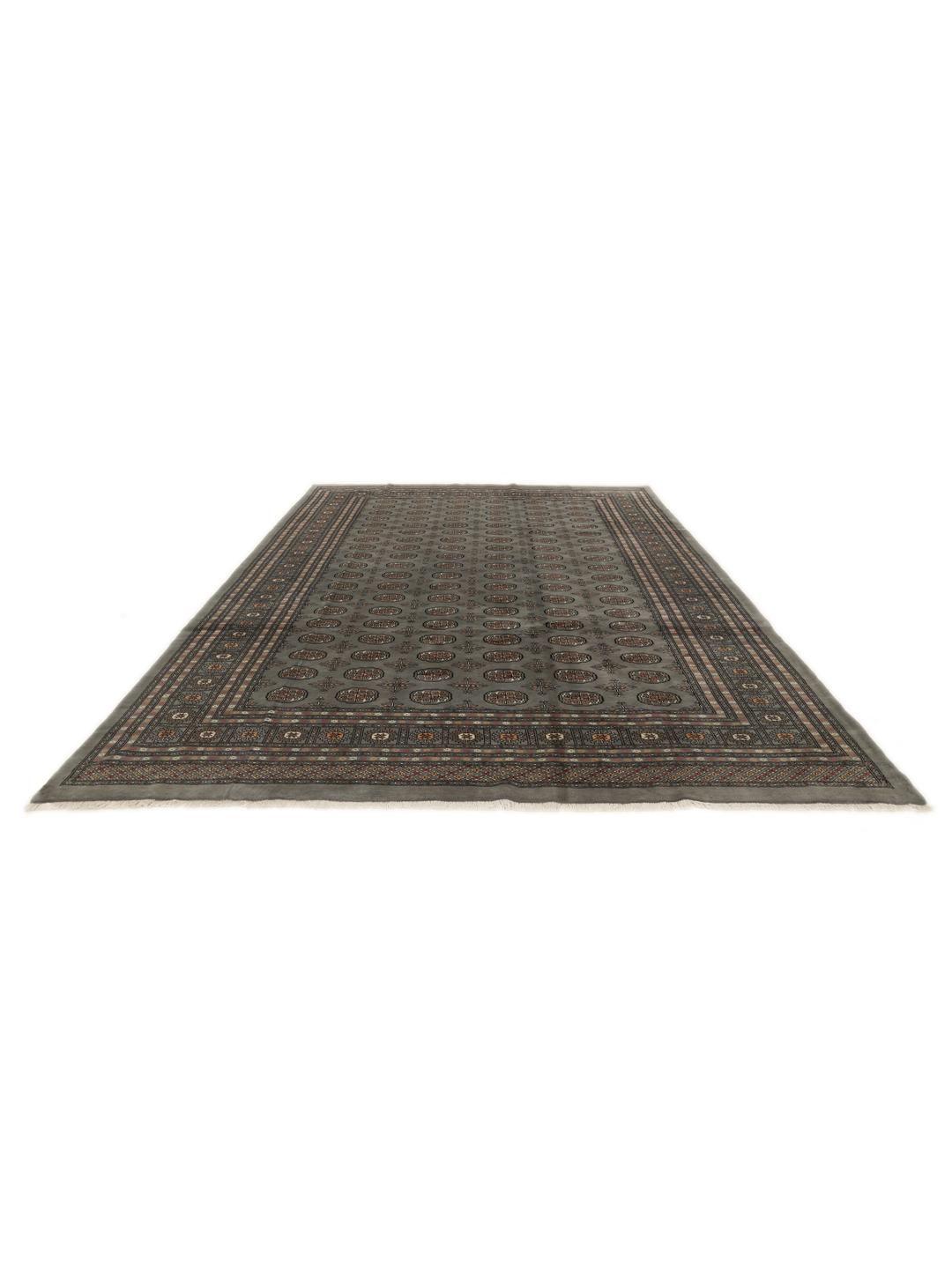 A hand-knotted Pakistan Bokhara rug in grey with traditional repeating motifs.