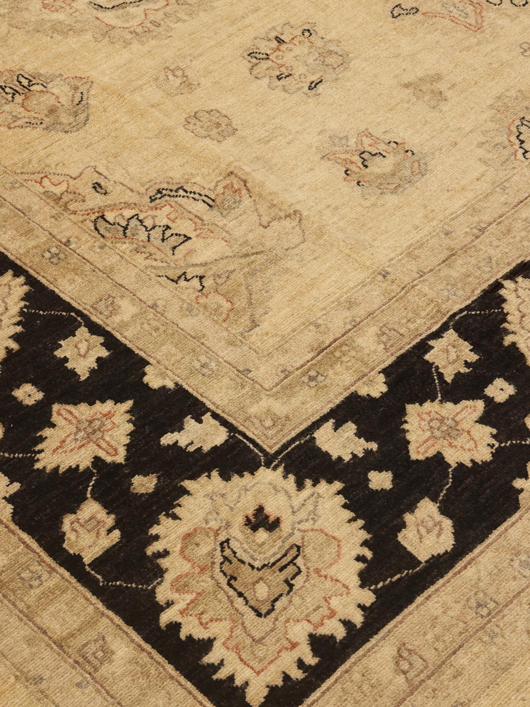 Handmade Ziegler rug from Afghanistan in beige and black with floral motifs