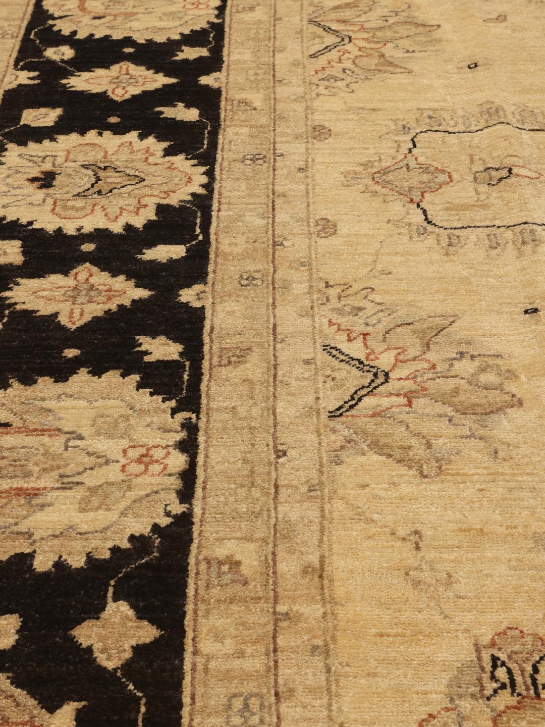Handmade Ziegler rug from Afghanistan in beige and black with floral motifs