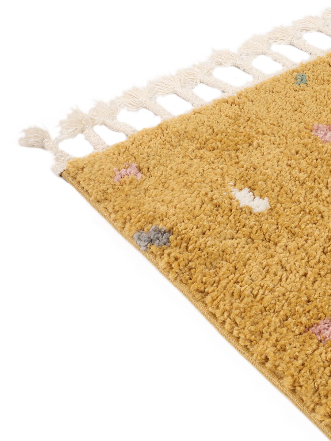 Geel vloerkleed met speelse meerkleurige stippen en franjes