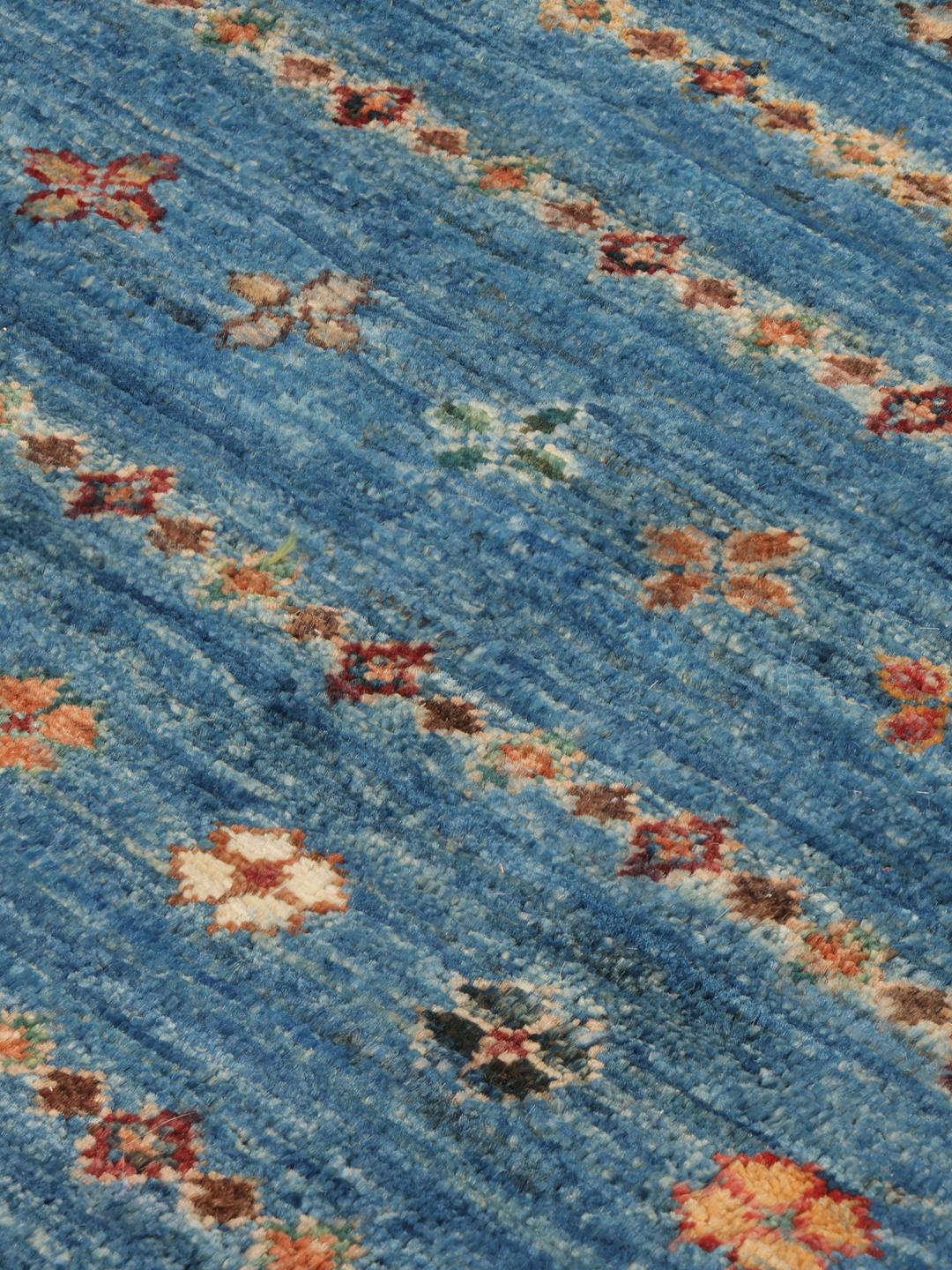 Handgeknoopt Afghaans tapijt met blauwe en rode geometrische patronen