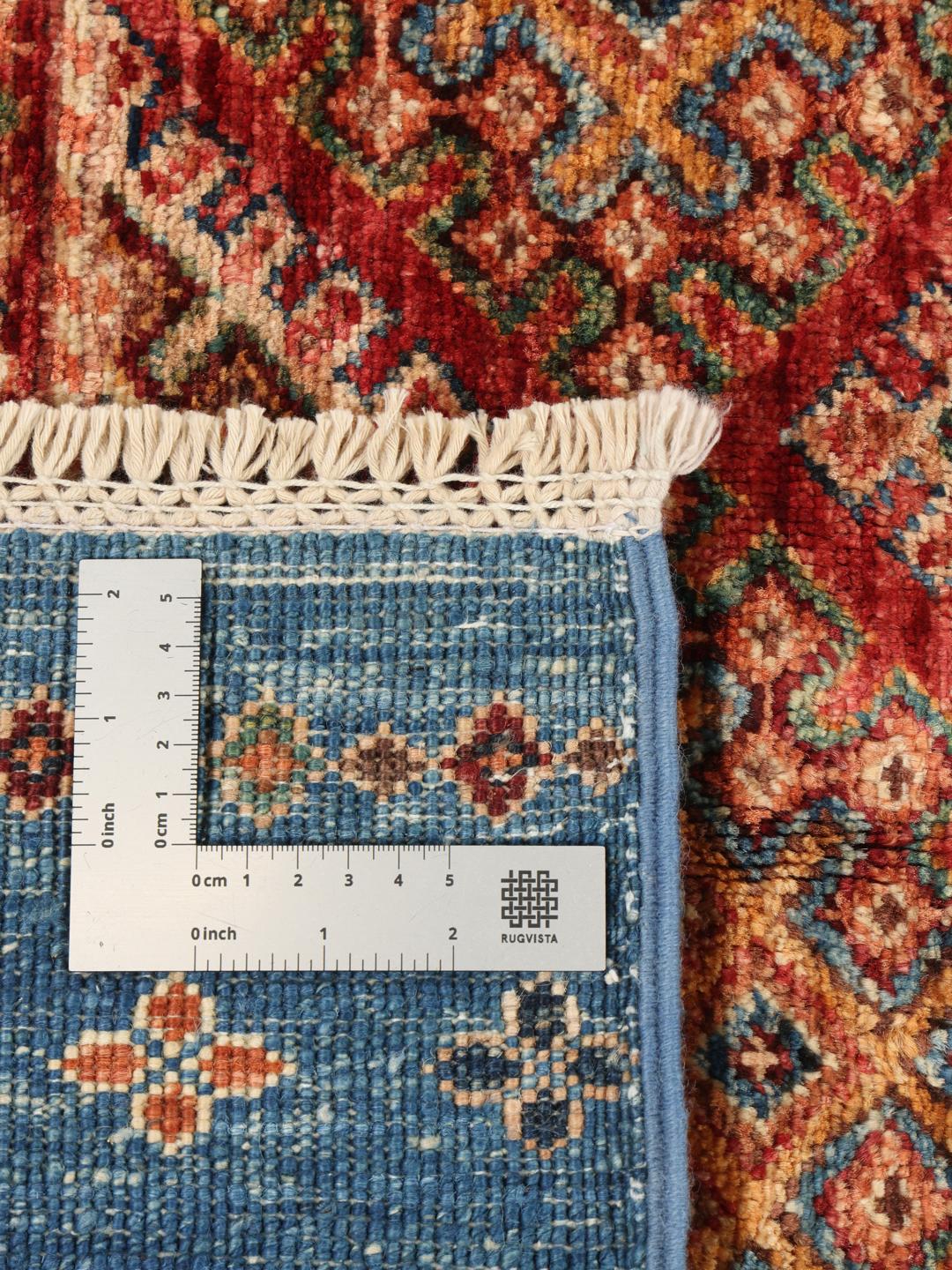 Handgeknoopt Afghaans tapijt met blauwe en rode geometrische patronen