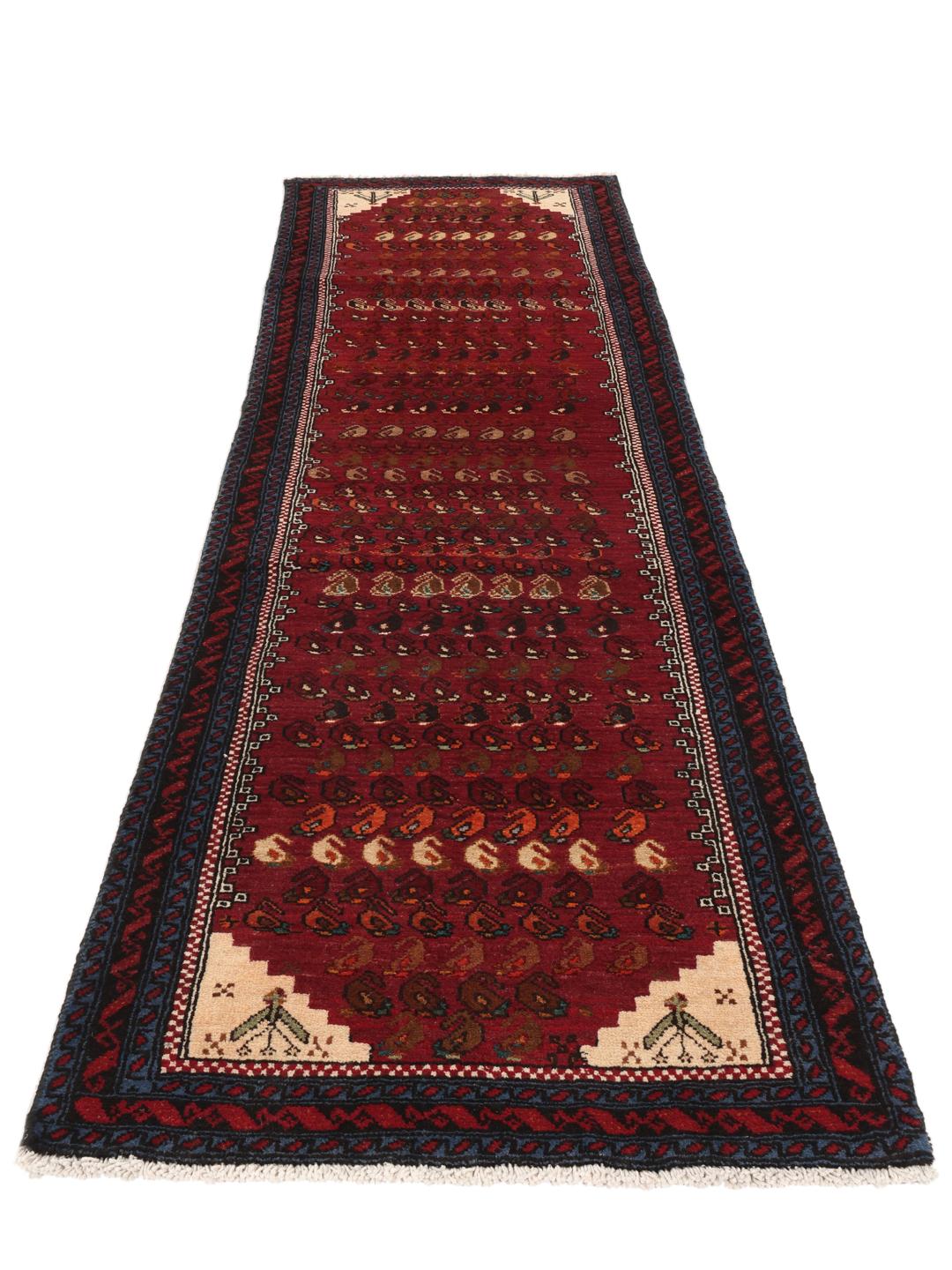 Handgeknoopte loper uit het Midden-Oosten in donkerrood met traditionele motieven