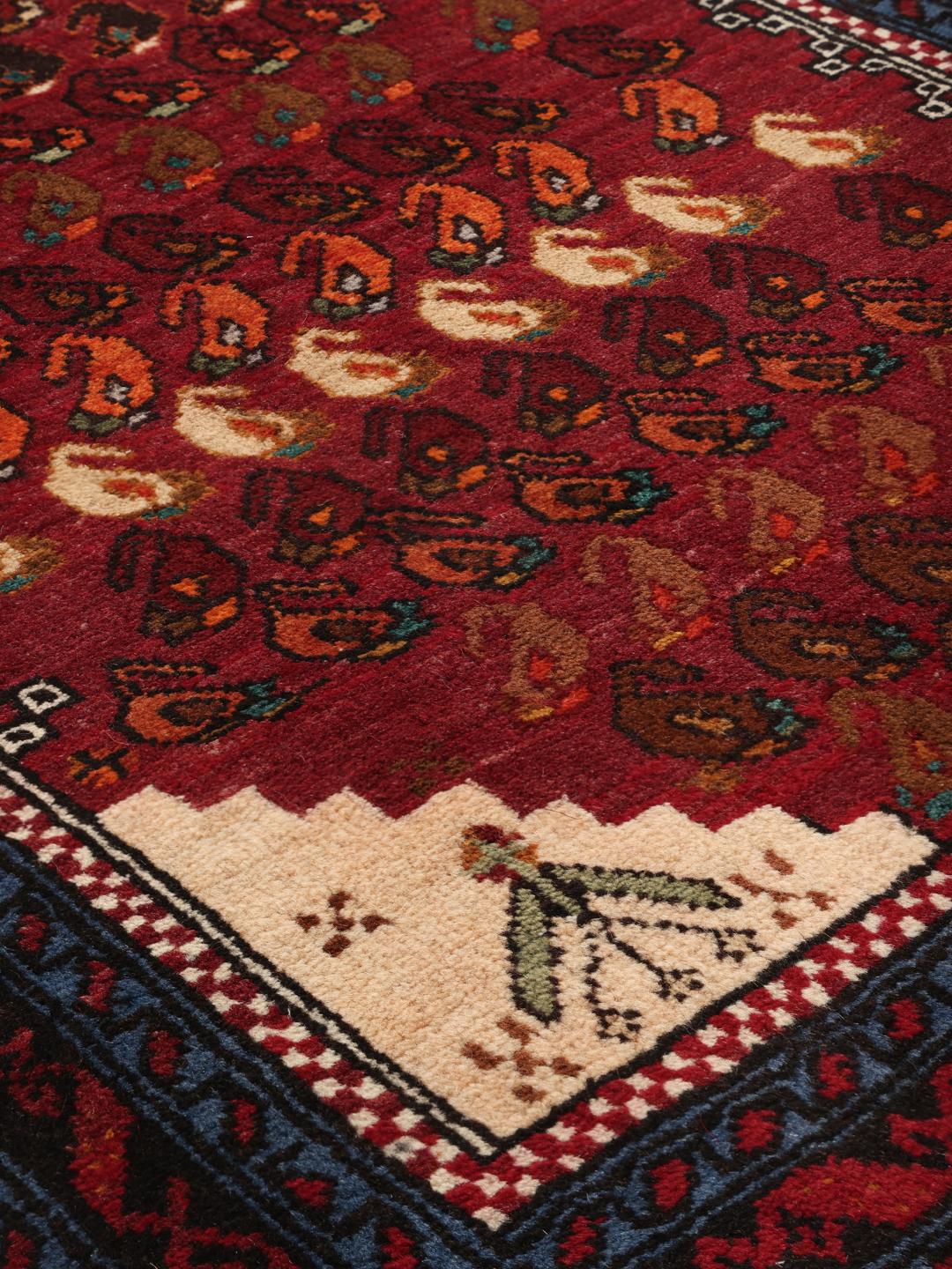 Handgeknoopte loper uit het Midden-Oosten in donkerrood met traditionele motieven