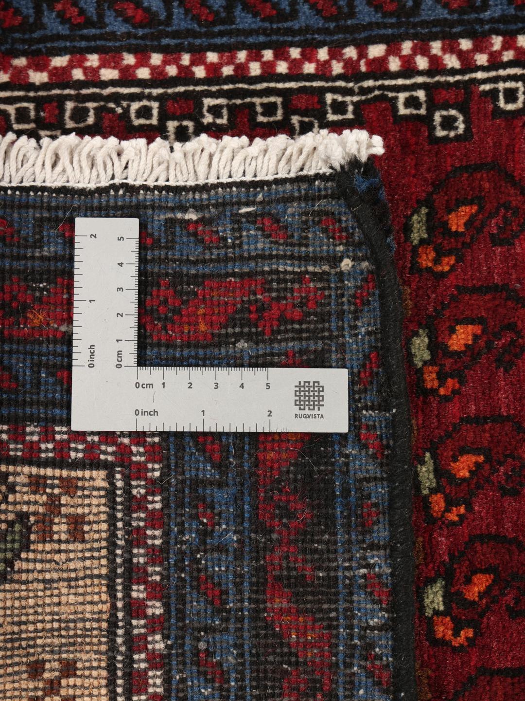 Handgeknoopte loper uit het Midden-Oosten in donkerrood met traditionele motieven