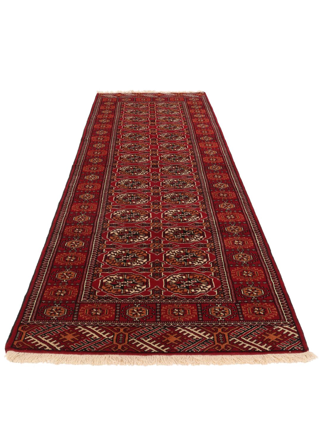Hand-knotted red Turkaman runner with intricate geometric patterns