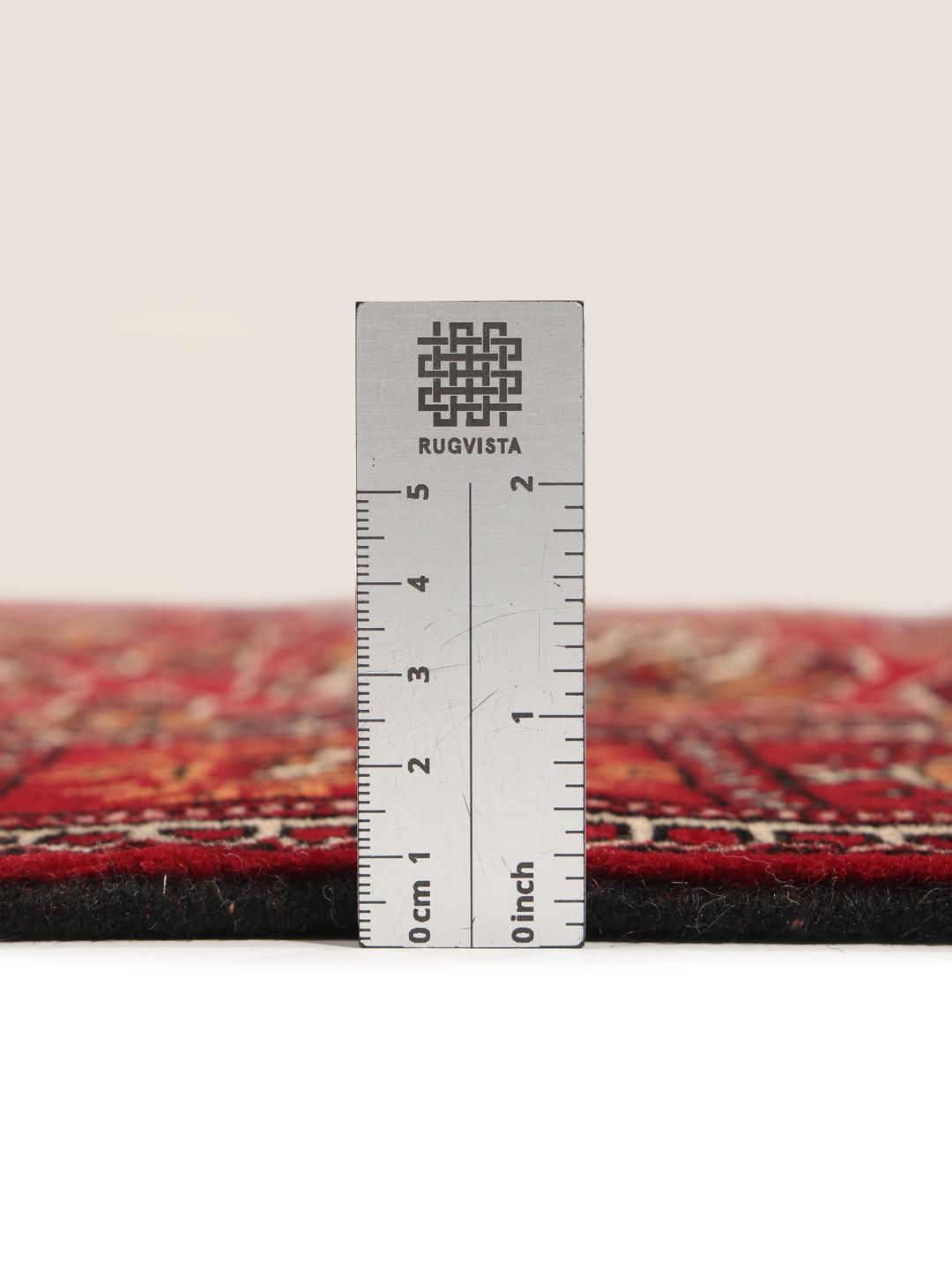 Hand-knotted red Turkaman runner with intricate geometric patterns