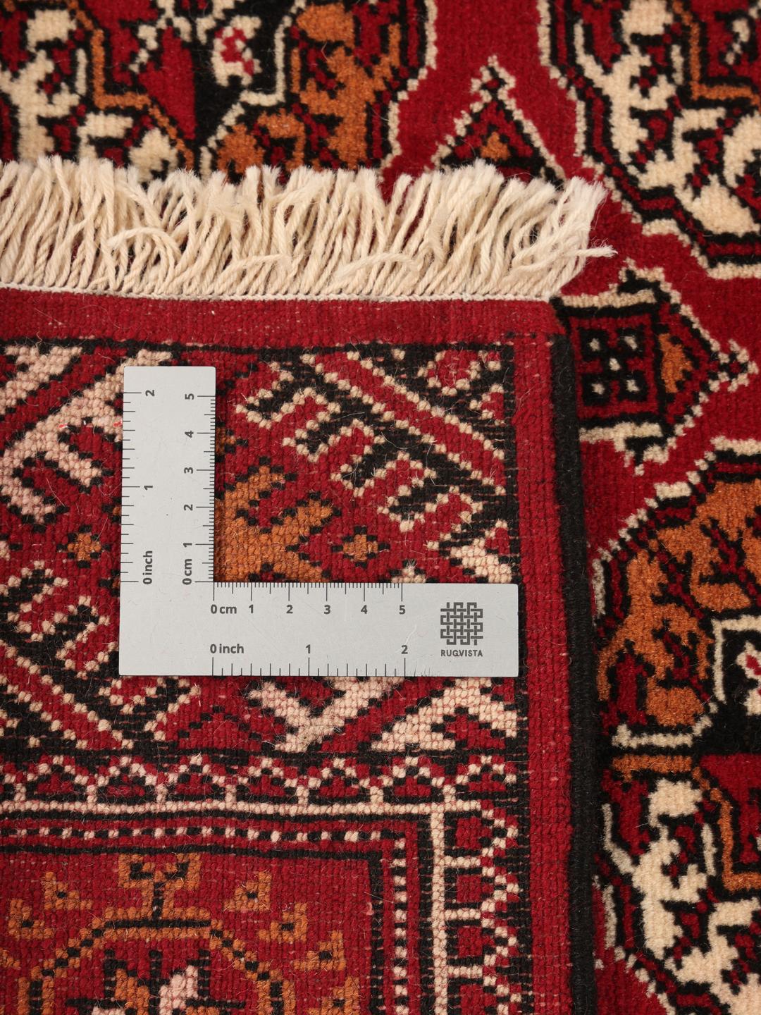 Hand-knotted red Turkaman runner with intricate geometric patterns