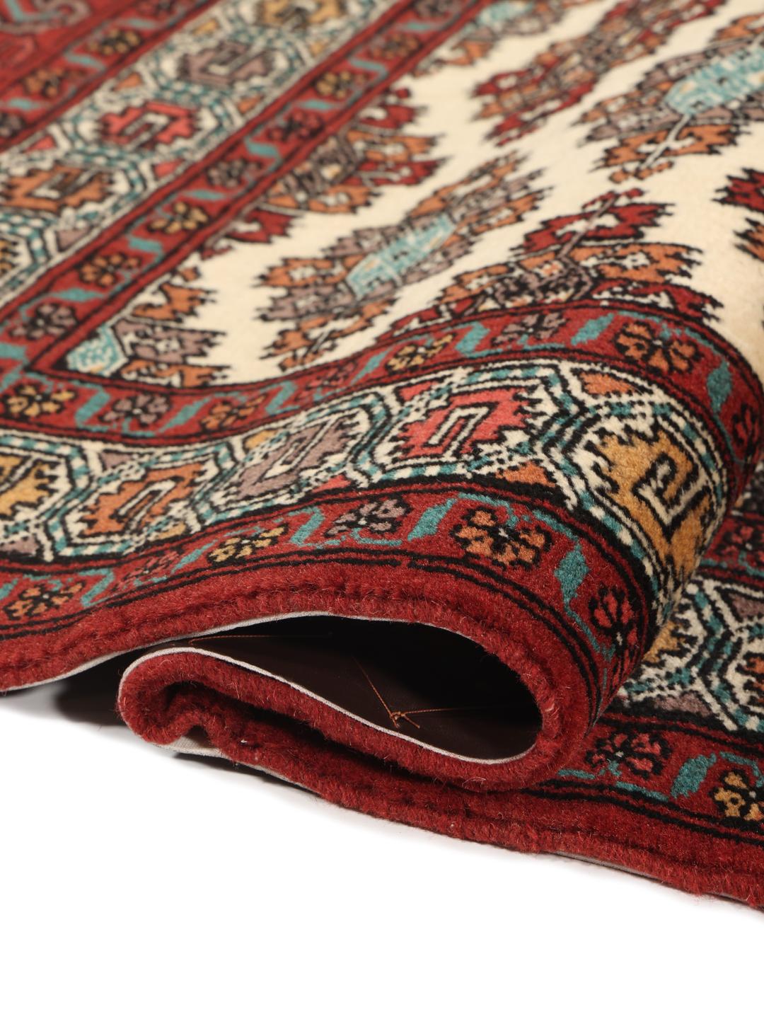 Hand-knotted Turkaman runner rug from the Middle East in red and beige tones.