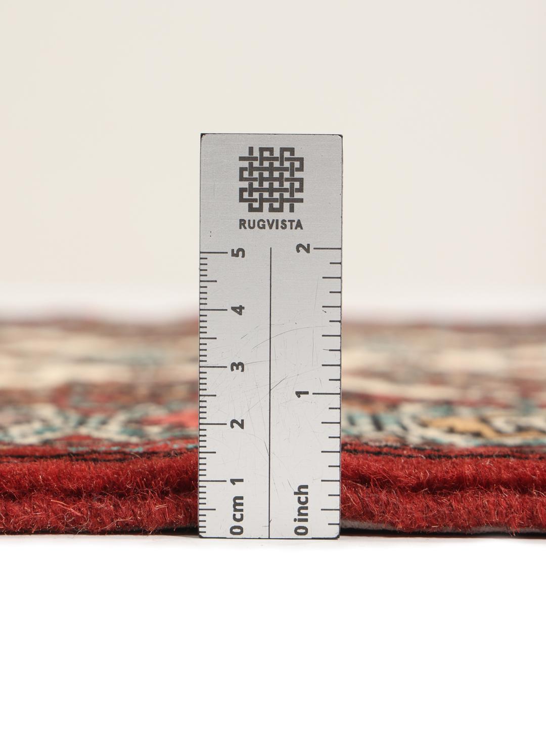 Hand-knotted Turkaman runner rug from the Middle East in red and beige tones.