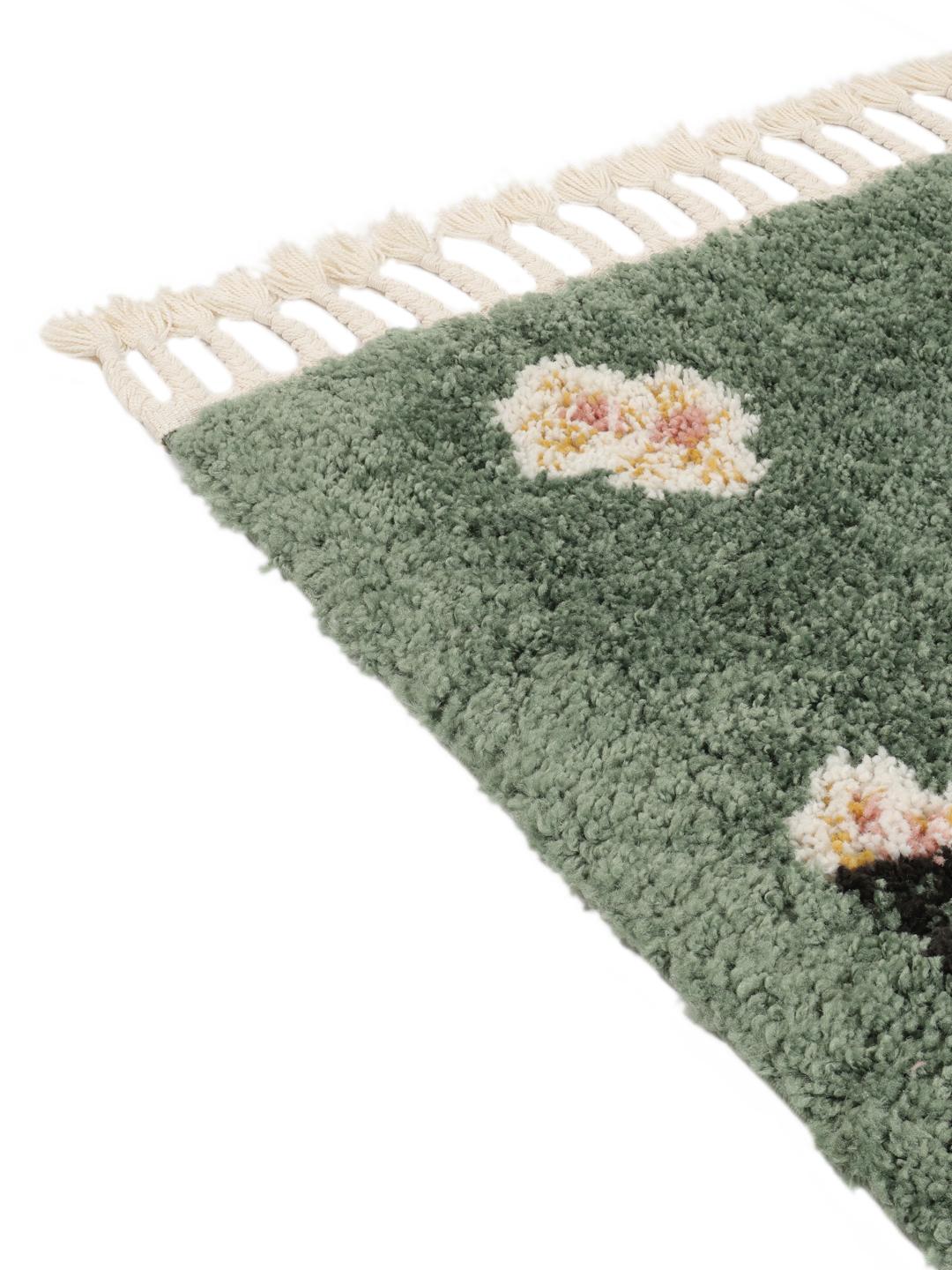 groen tapijt met bloemmotieven en franjes
