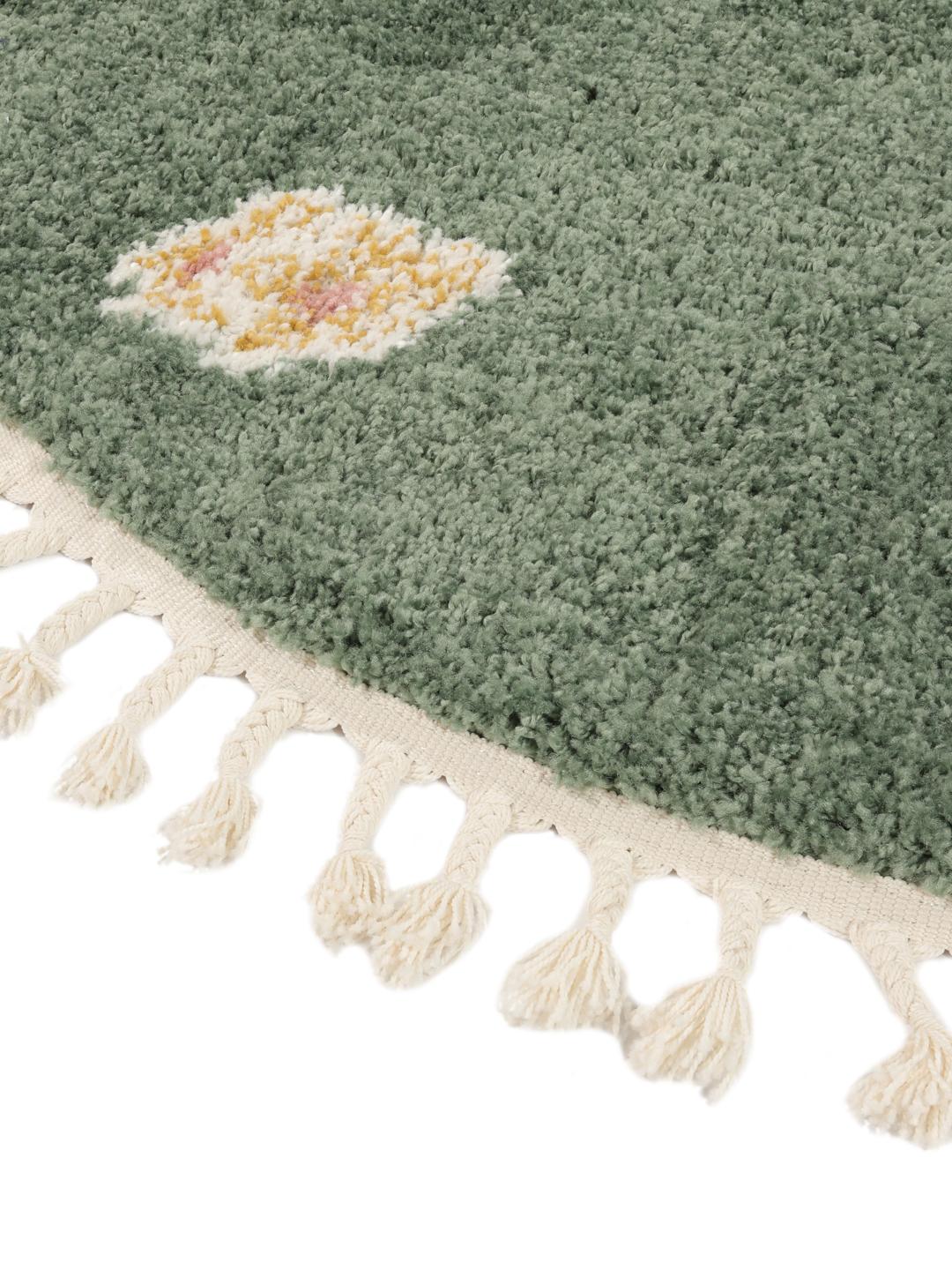 Groen rond vloerkleed met bloemmotieven en franjes