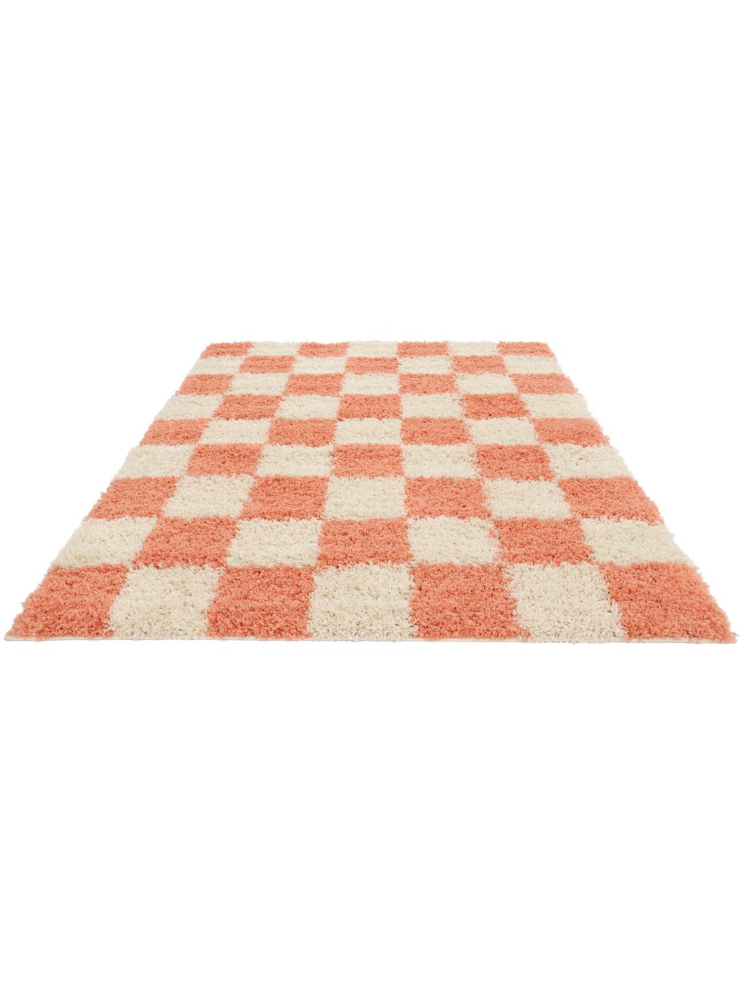 Oranje tapijt met een zacht oppervlak met hoge pool